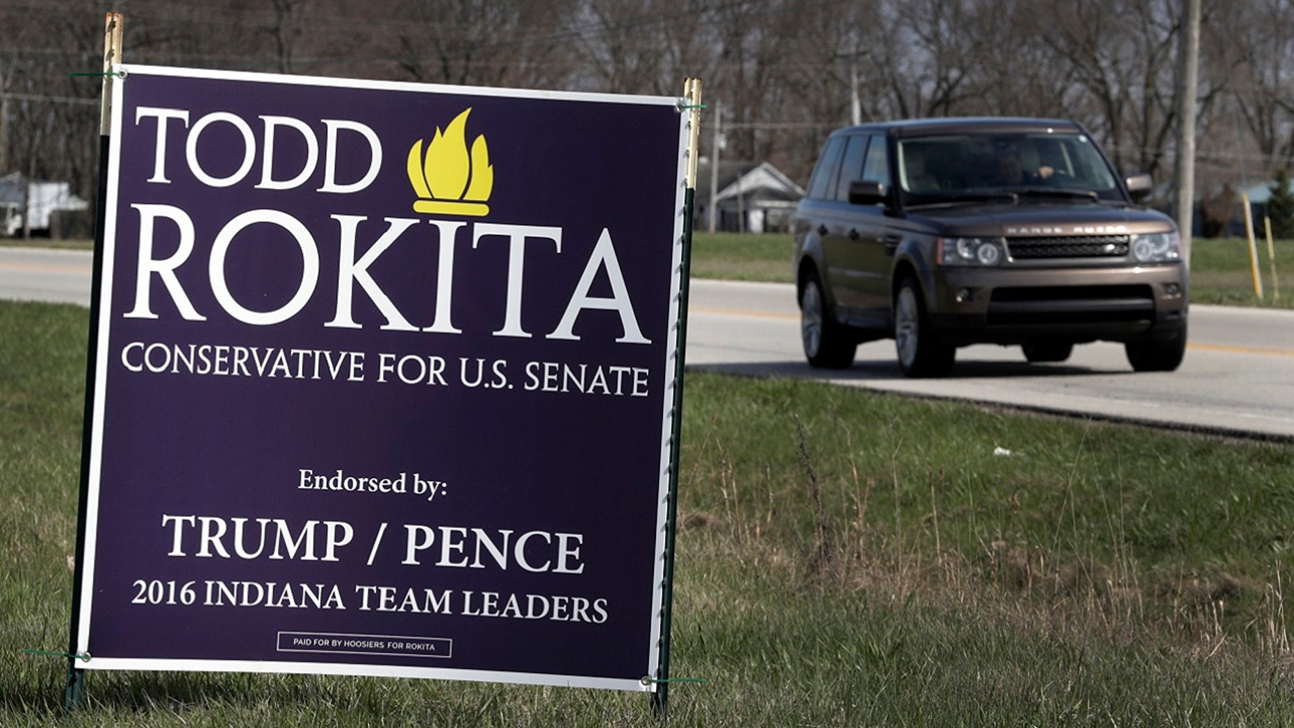 A sign promoting the campaign of GOP Senate candidate Todd Rokita is shown along a state highway in Brownsburg, Ind., Tuesday, April 17, 2018. Donald Trump's re-election campaign has issued a rebuke to Rokita, ordering the Republican to take down yard signs that could give a false impression that Rokita is endorsed by the president, two officials with direct knowledge of the matter told The Associated Press.