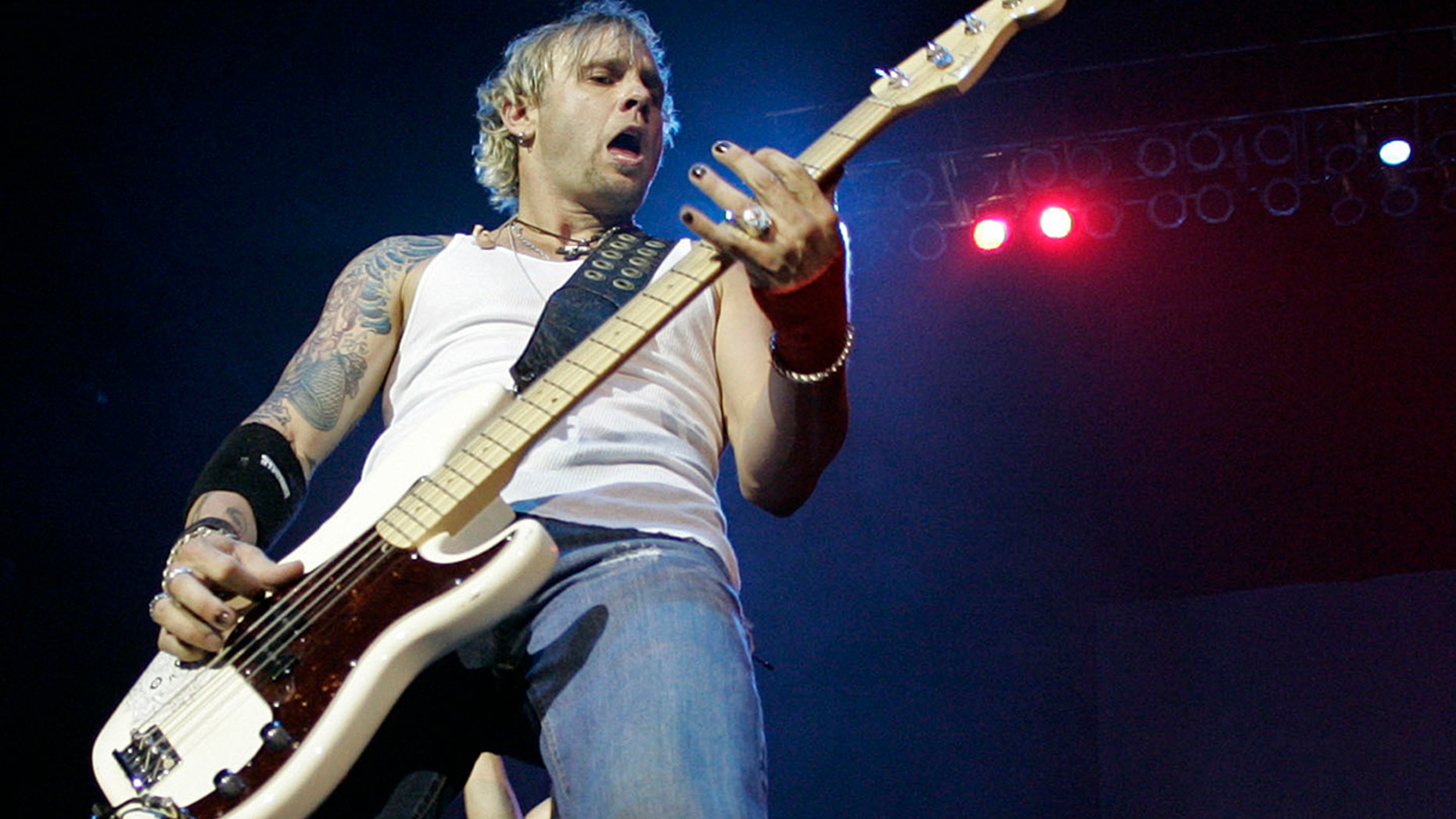 FILE - In a June 27, 2009 file photo, 3 Doors Down bass guitarist Todd Harrell performs during the band's tour stop at the Cynthia Woods Mitchell Pavilion in The Woodlands, Texas. Jackson County Sheriff Mike Ezell, in a news release, said 46-year-old Harrell, the band's original bass player, was arrested Friday, June 15, 2018 at his St. Martin, Miss. home after after guns and drugs were seen there. (Eric S. Swist/Houston Chronicle via AP, File)