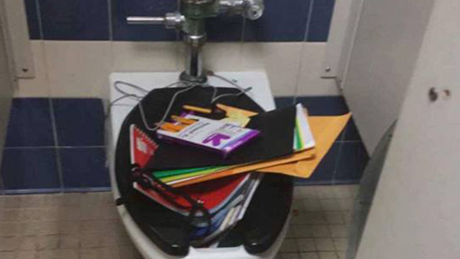 Alexis Hernandez's two classmates dumped his school supplies in the toilet.