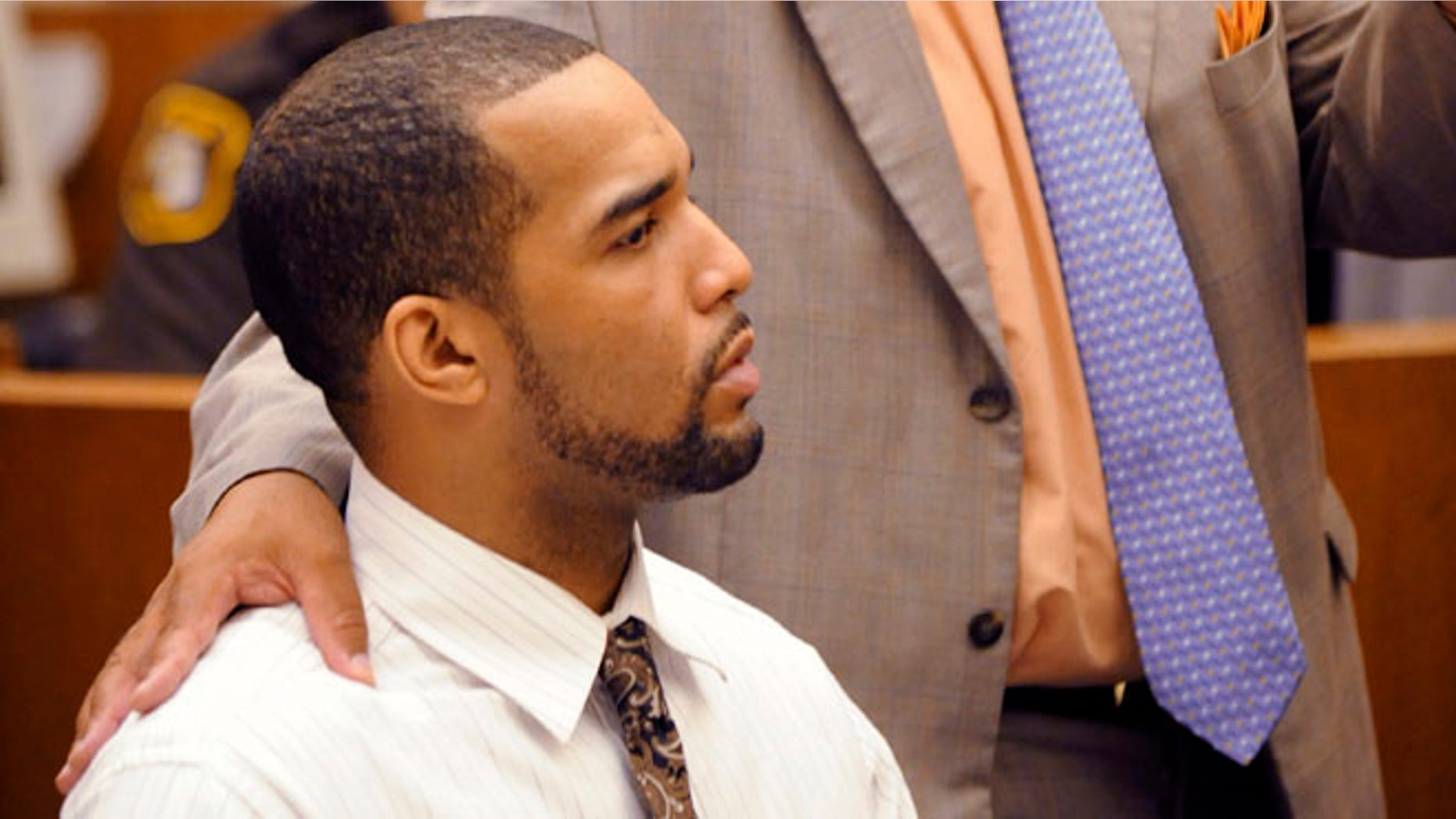 Sept. 19, 2012: D'Andre Lane, left, listens to his defense attorney Terry L. Johnson speak during Lane's trial before Judge Vonda R. Evans at Frank Murphy Hall of Justice in Detroit.