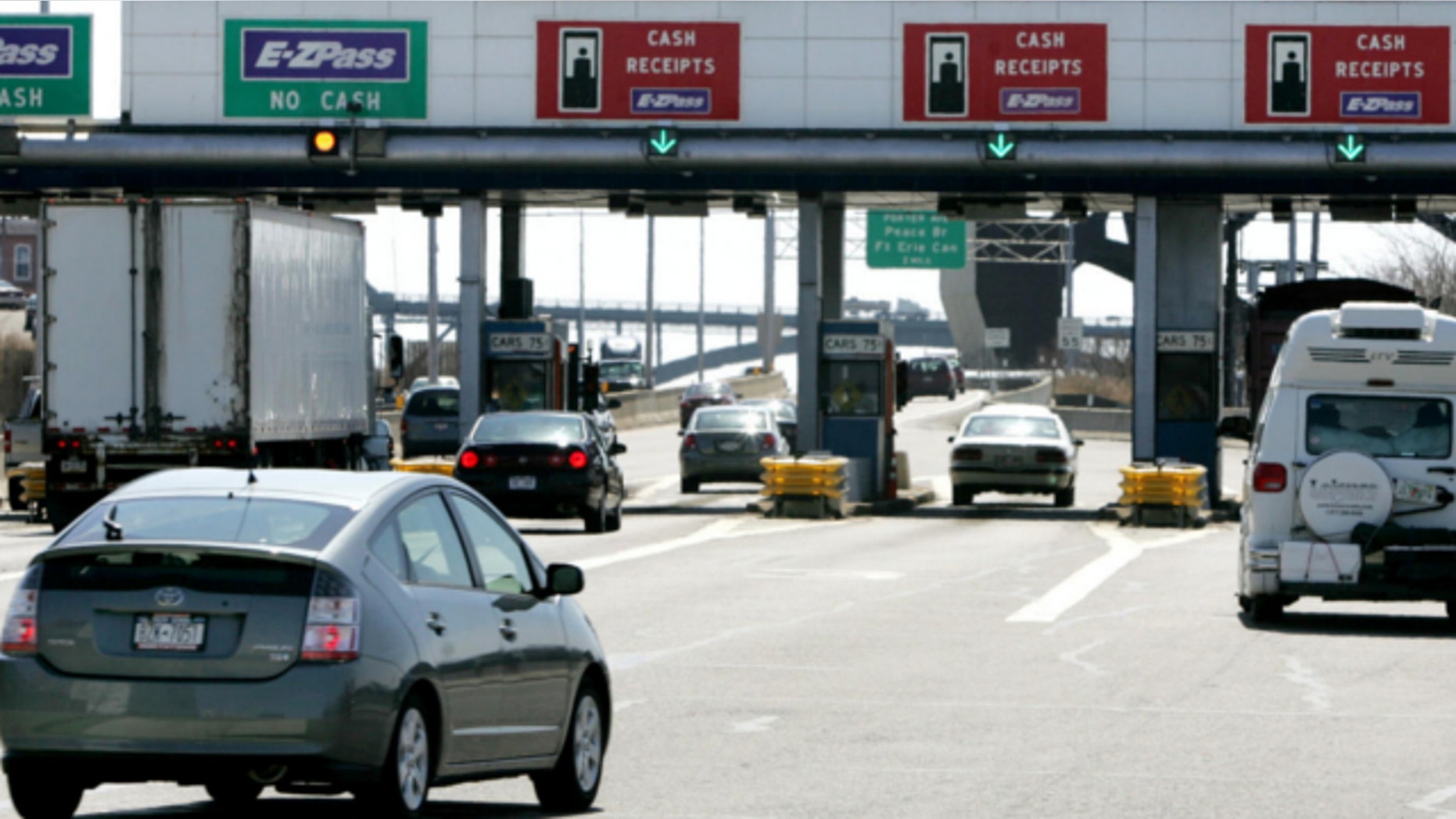 April 10, 2006: Motorists pass through a New York Thuway Authority toll booth, Buffalo, New York.