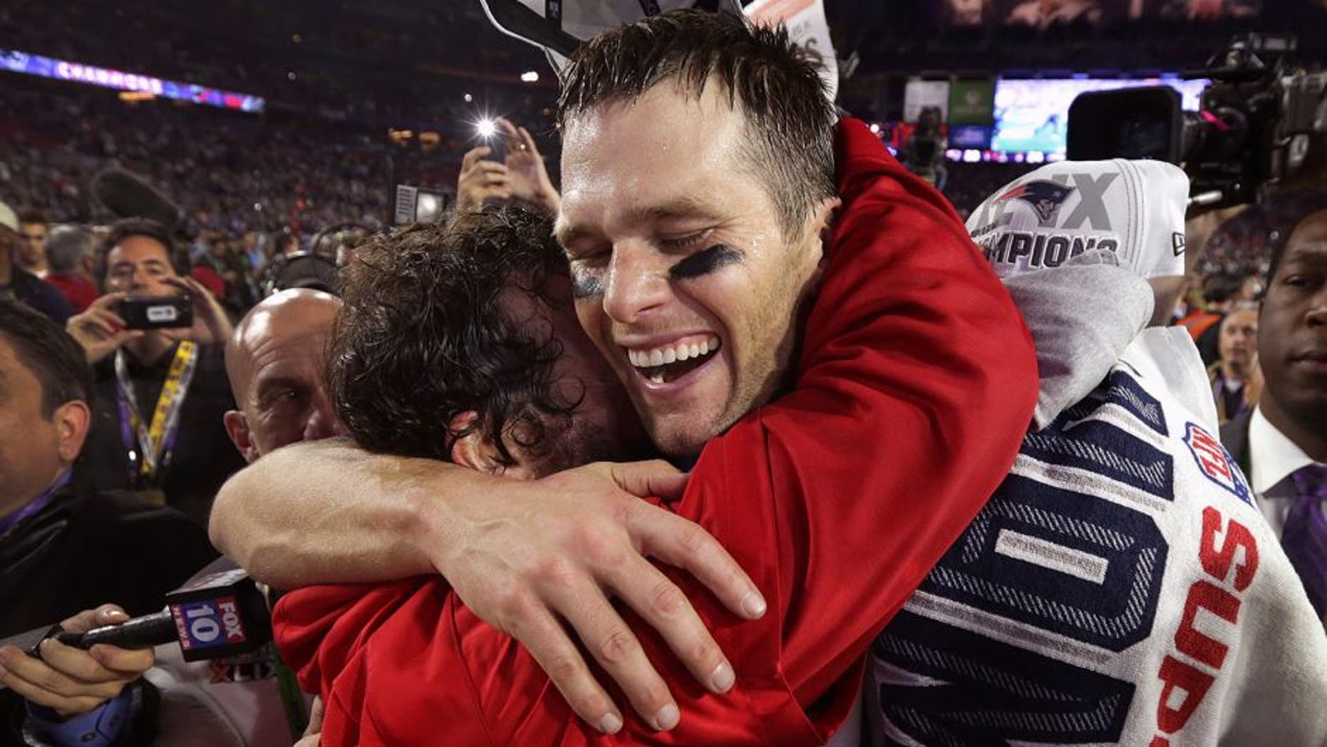 GLENDALE, AZ - FEBRUARY 1: New England Patriots quarterback Tom Brady shares a hug with Patriots defensive coordinator Matt Patricia after winning Super Bowl XLIX. (Photo by Barry Chin/The Boston Globe via Getty Images)