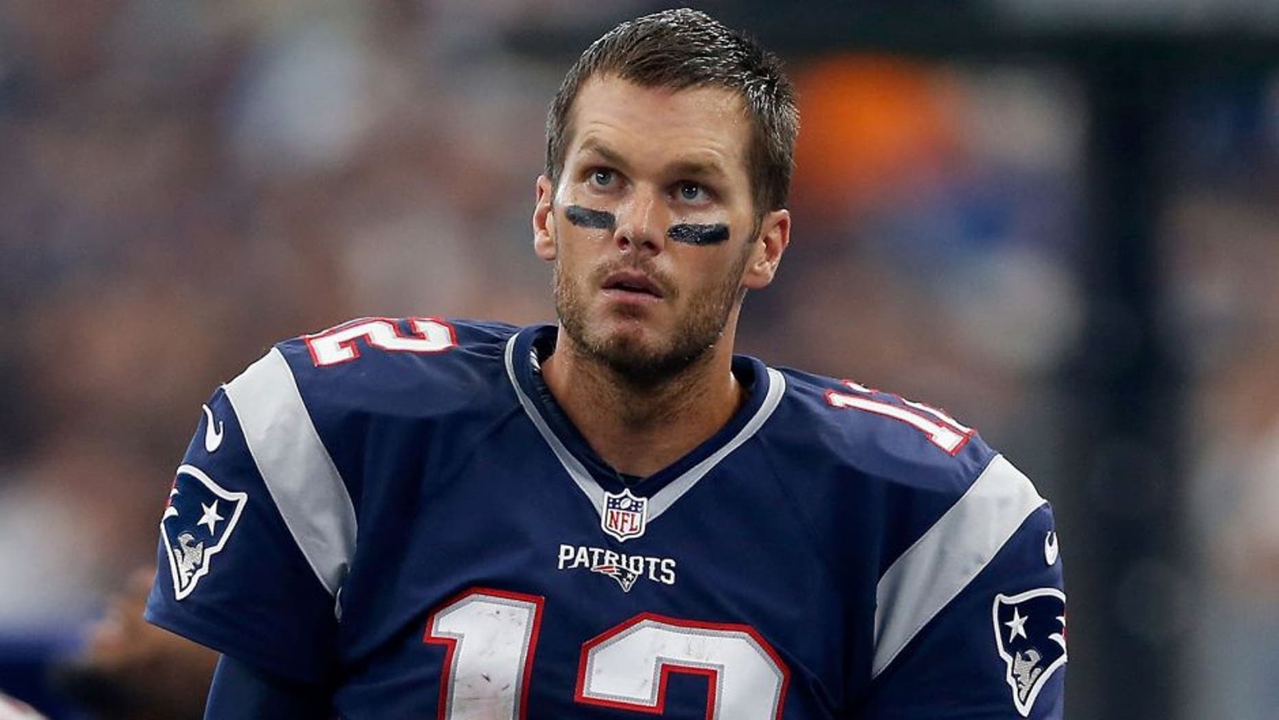 ARLINGTON, TX - OCTOBER 11: Quarterback Tom Brady #12 of the New England Patriots stands on the sideline during the first half of the NFL game against the Dallas Cowboys at AT&T Stadium on October 11, 2015 in Arlington, Texas. (Photo by Christian Petersen/Getty Images)