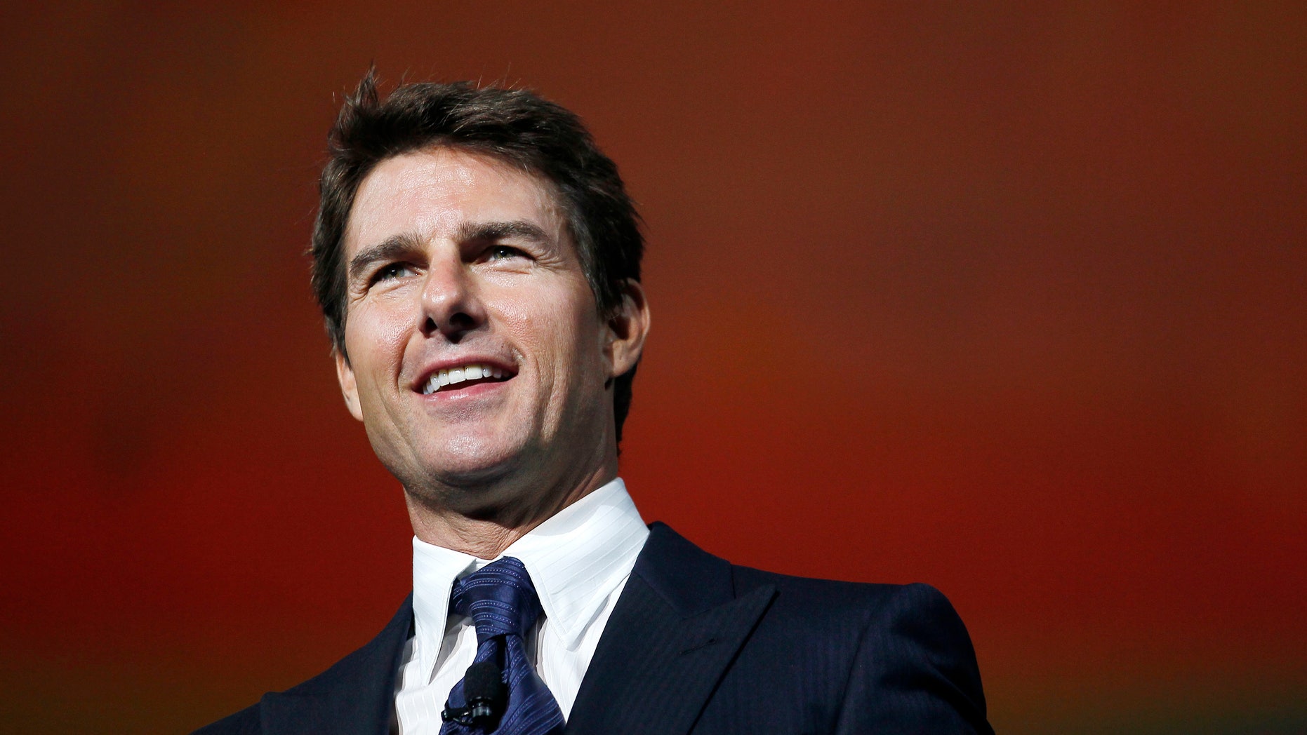 Actor Tom Cruise arrives on stage at the annual shareholders meeting for Walmart in Fayetteville, Arkansas June 7, 2013.