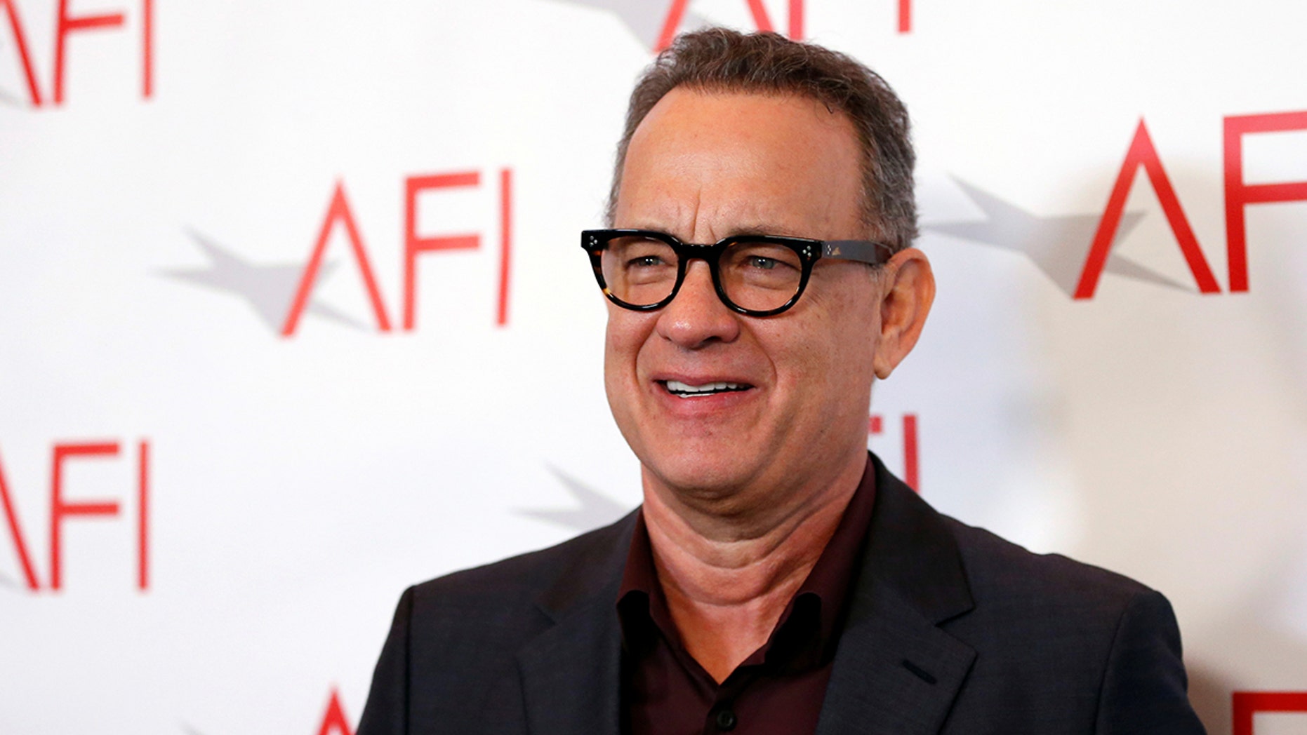 Actor Tom Hanks poses at the AFI AWARDS 2017 luncheon in Los Angeles, California, U.S., January 5, 2018. REUTERS/Mario Anzuoni - RC1480564750