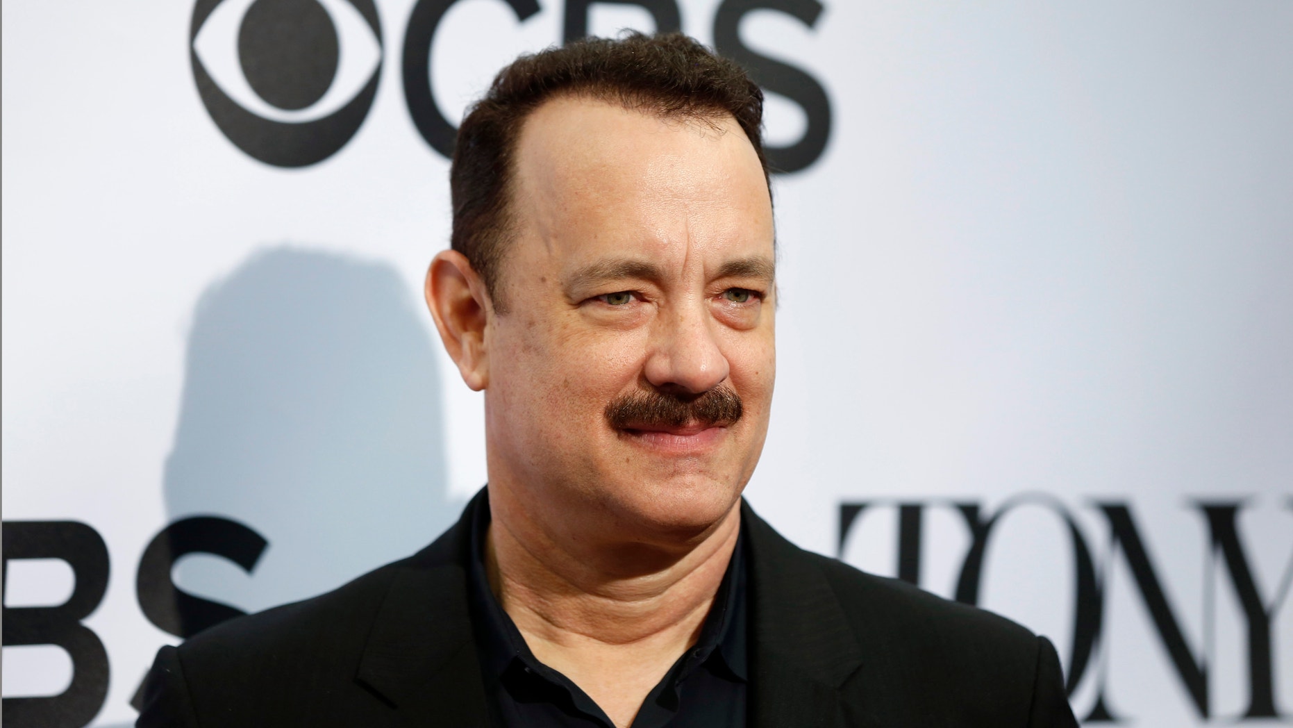 Actor Tom Hanks, nominated for a Tony Award for his acting in the play Lucky Guy, arrives for the 2013 Tony Awards Meet The Nominees Press Reception in New York, May 1, 2013.