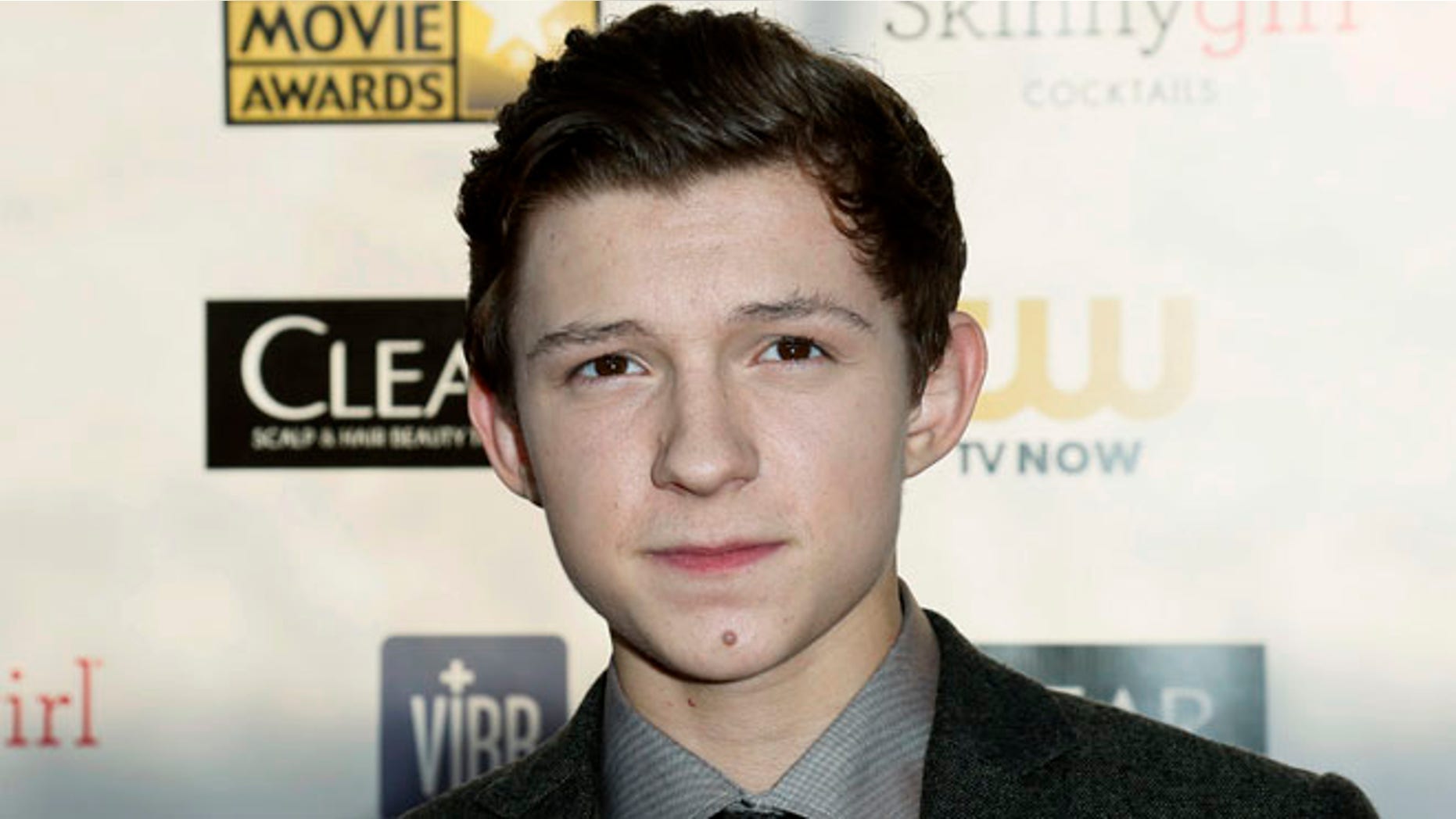 REFILING ADDING HEADLINE - Actor Tom Holland from "The Impossible" arrives at the 2013 Critic's Choice Awards in Santa Monica, California January 10, 2013. REUTERS/Danny Moloshok (UNITED STATES - Tags: ENTERTAINMENT) - RTR3CAUM