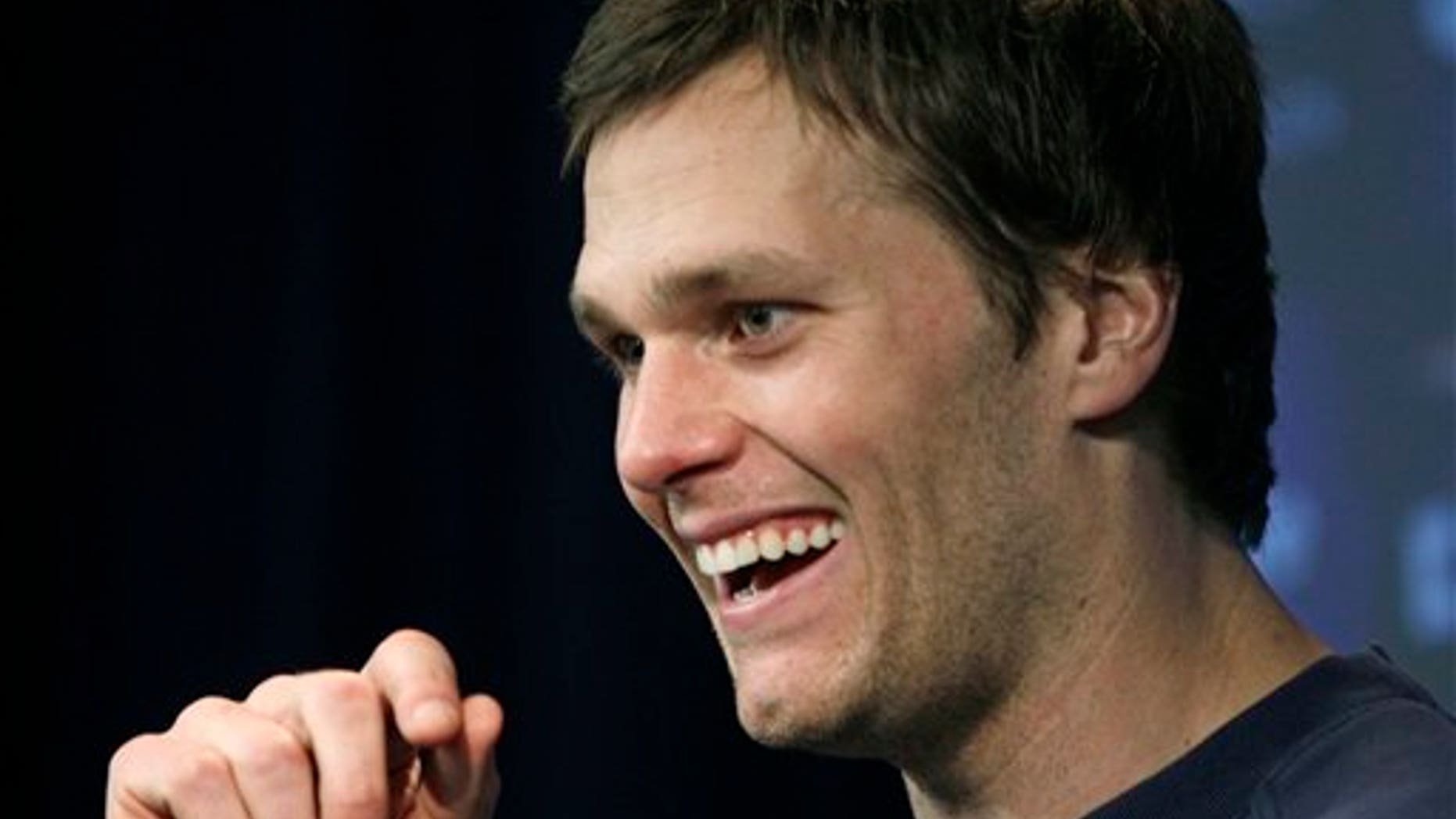 New England Patriots quarterback Tom Brady laughs during a news conference at Gillette Stadium in Foxborough, Mass., Thursday, Jan. 26, 2012. The Patriots are scheduled to face the New York Giants in the Super Bowl on Feb. 5 in Indianapolis. (AP Photo/Elise Amendola)