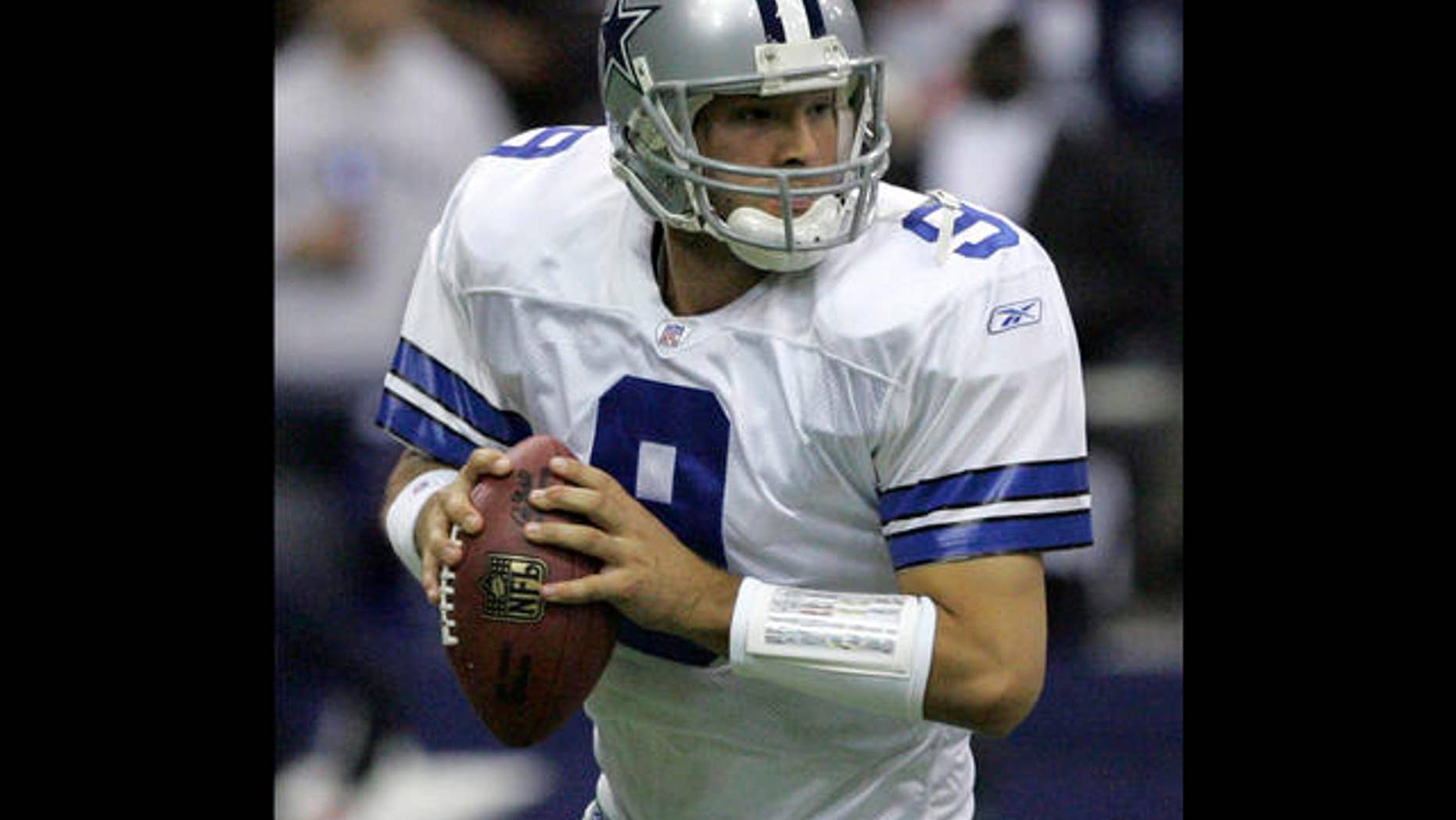 Dallas Cowboys quarterback Tony Romo (9) fades back looking for a receiver in the third quarter against the New York Giants in their football game in Irving, Texas, Monday, Oct. 23, 2006. (AP Photo/L.M. Otero)