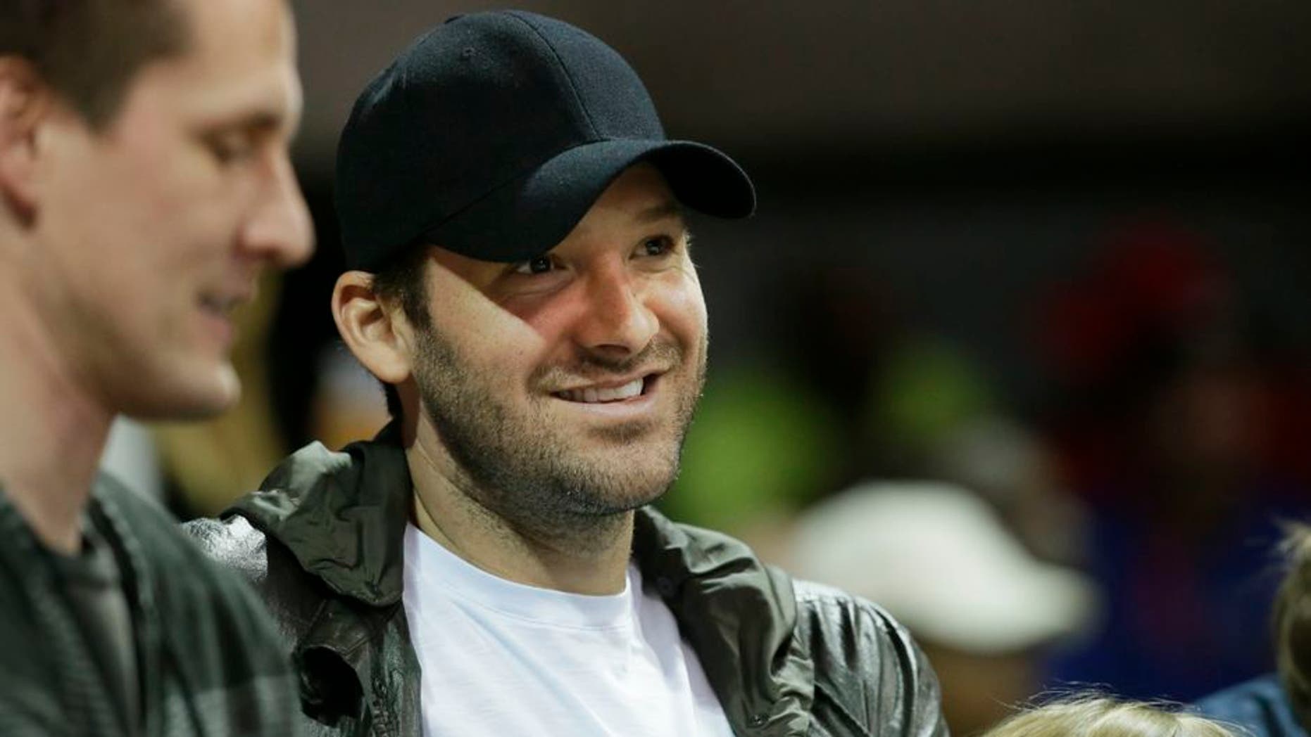 Dallas Cowboys quarterback Tony Romo watches during the first half of an NCAA college basketball game between Cincinnati and SMU in Dallas, Sunday, Feb. 12, 2017. (AP Photo/LM Otero)