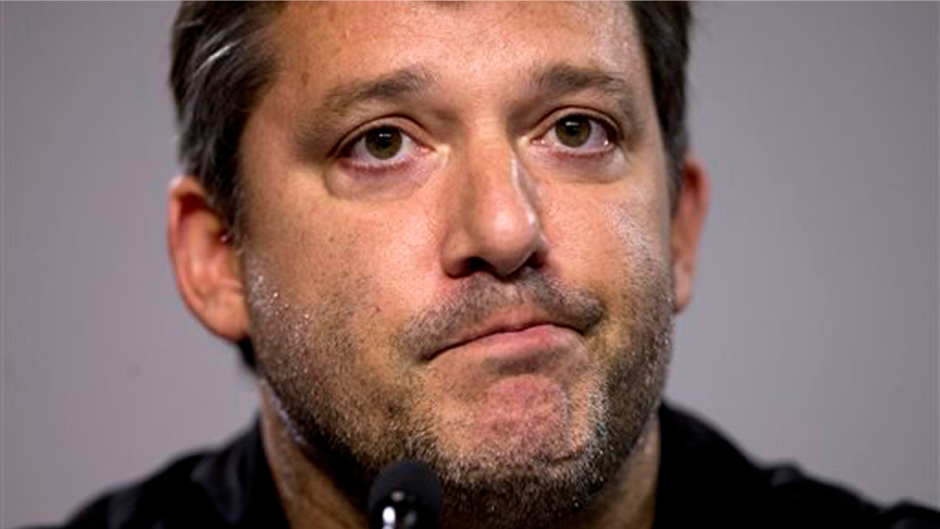 Aug. 29, 2014: In this photo, NASCAR auto racing driver Tony Stewart reads a statement during a news conference at Atlanta Motor Speedway in Hampton, Ga.