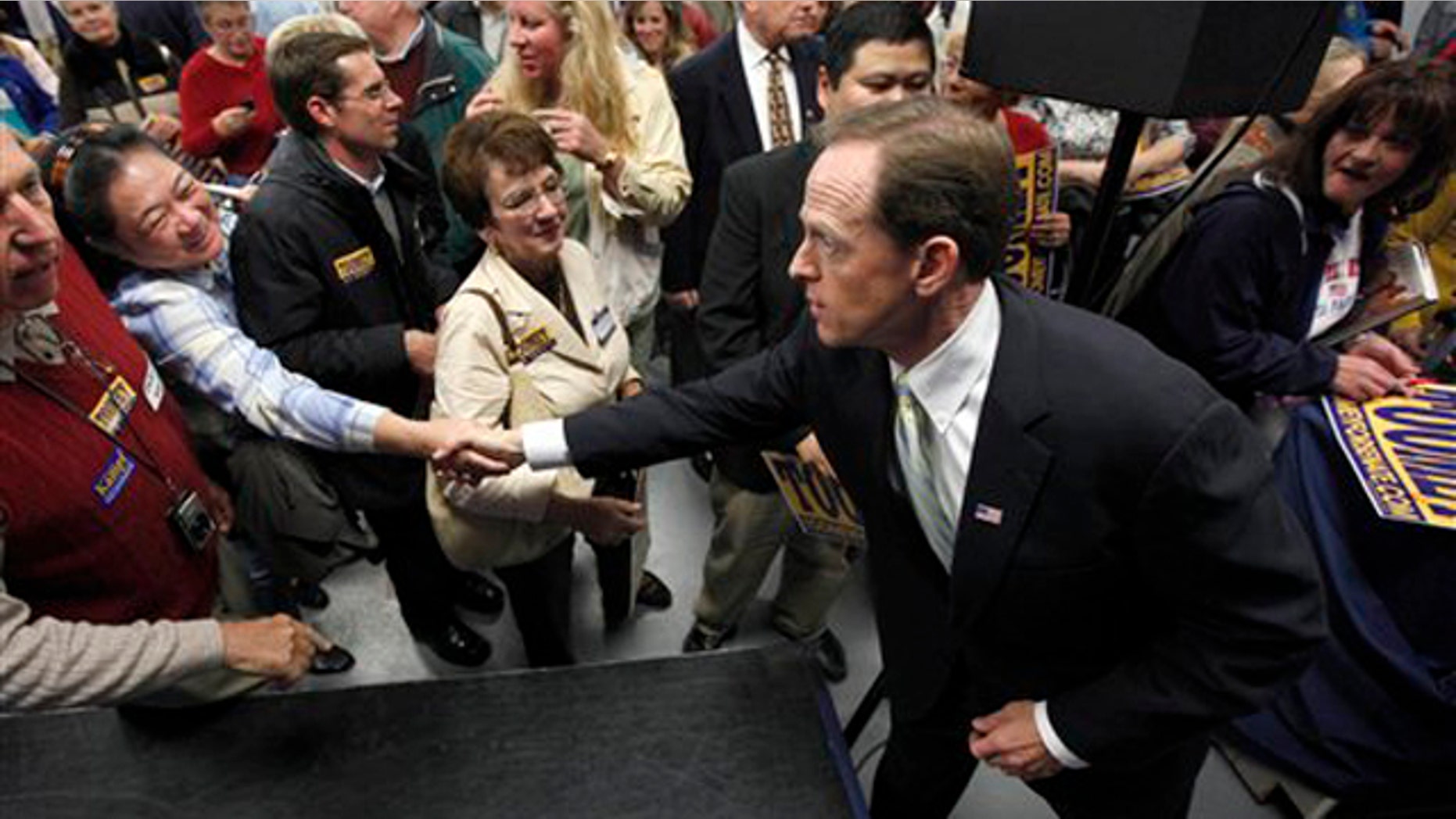 In this Oct. 22 photo, Pennsylvania Republican Senate candidate Pat Toomey meets with supporters at a rally in Blue Bell, Pa. (AP Photo)