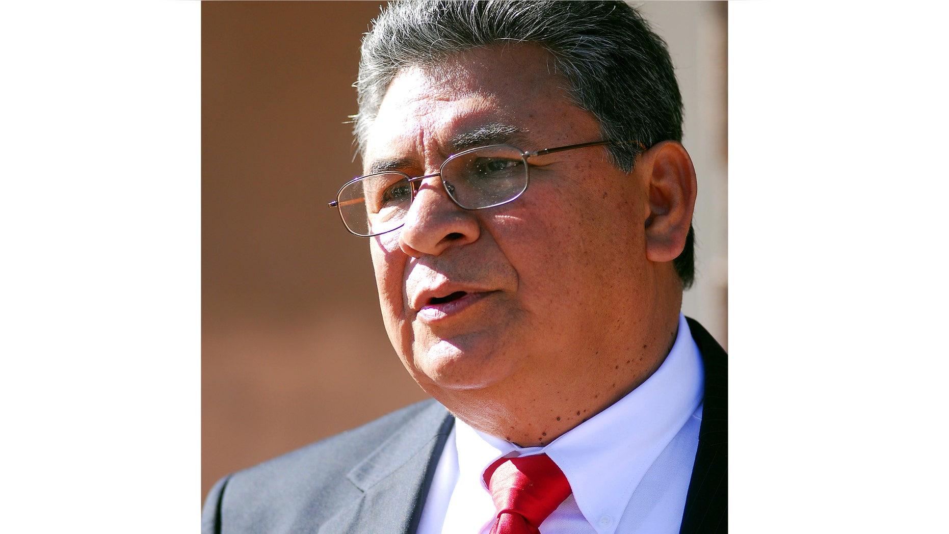Sunland Park, N.M. mayoral candidate Gerardo Hernandez, above, speaks in front of city hall in Las Cruces, N.M. Mayor-elect Daniel Salinas and two other city workers arrested and jailed on charges they tried to force Hernandez, from the race by threatening to release a secretly recorded video of him getting a lap dance.