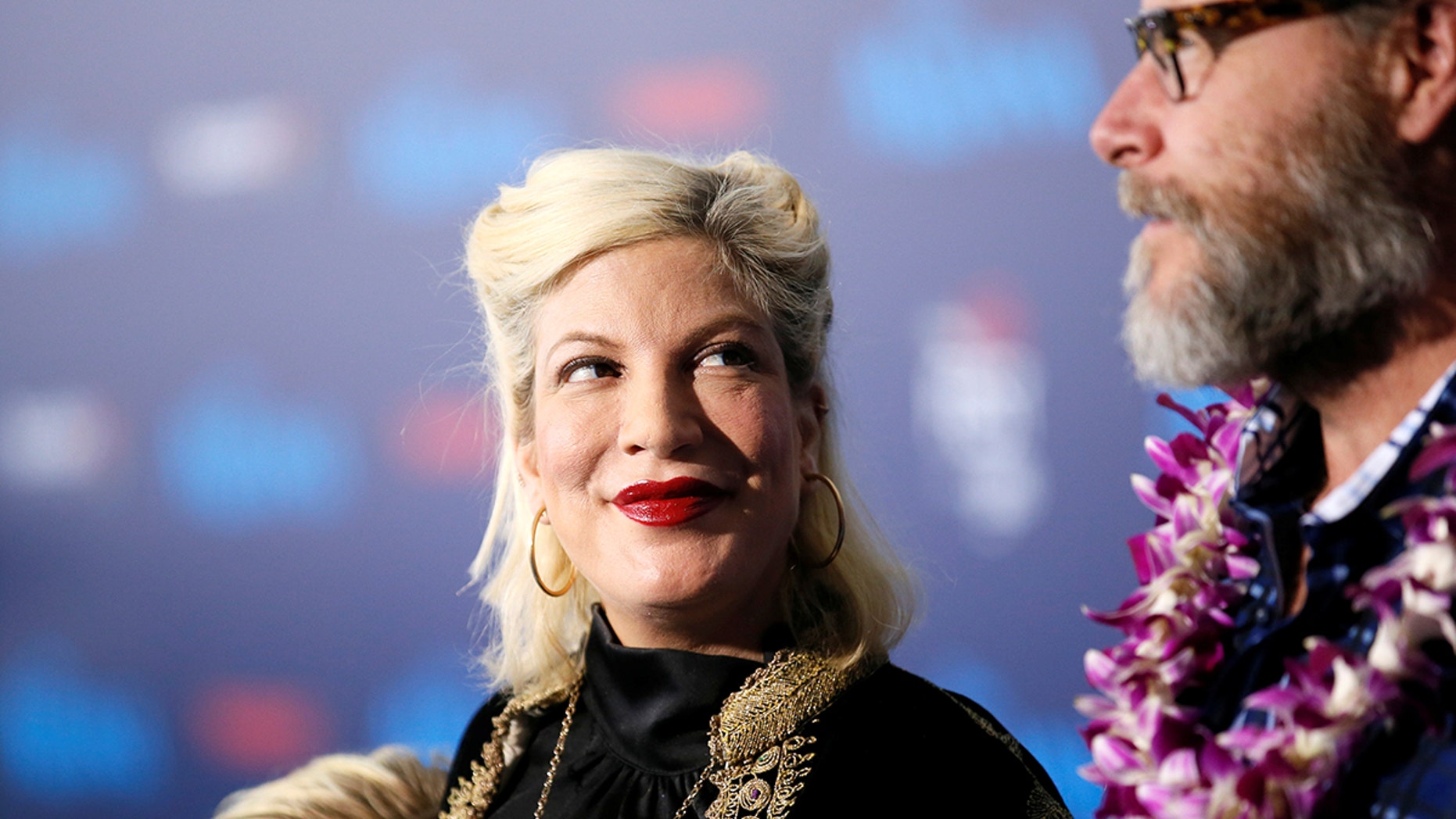 Actor Tori Spelling and husband Dean McDermott pose at the world premiere of Walt Disney Animation Studios' "Moana" as a part of AFI Fest in Hollywood, California, Nov. 14, 2016.