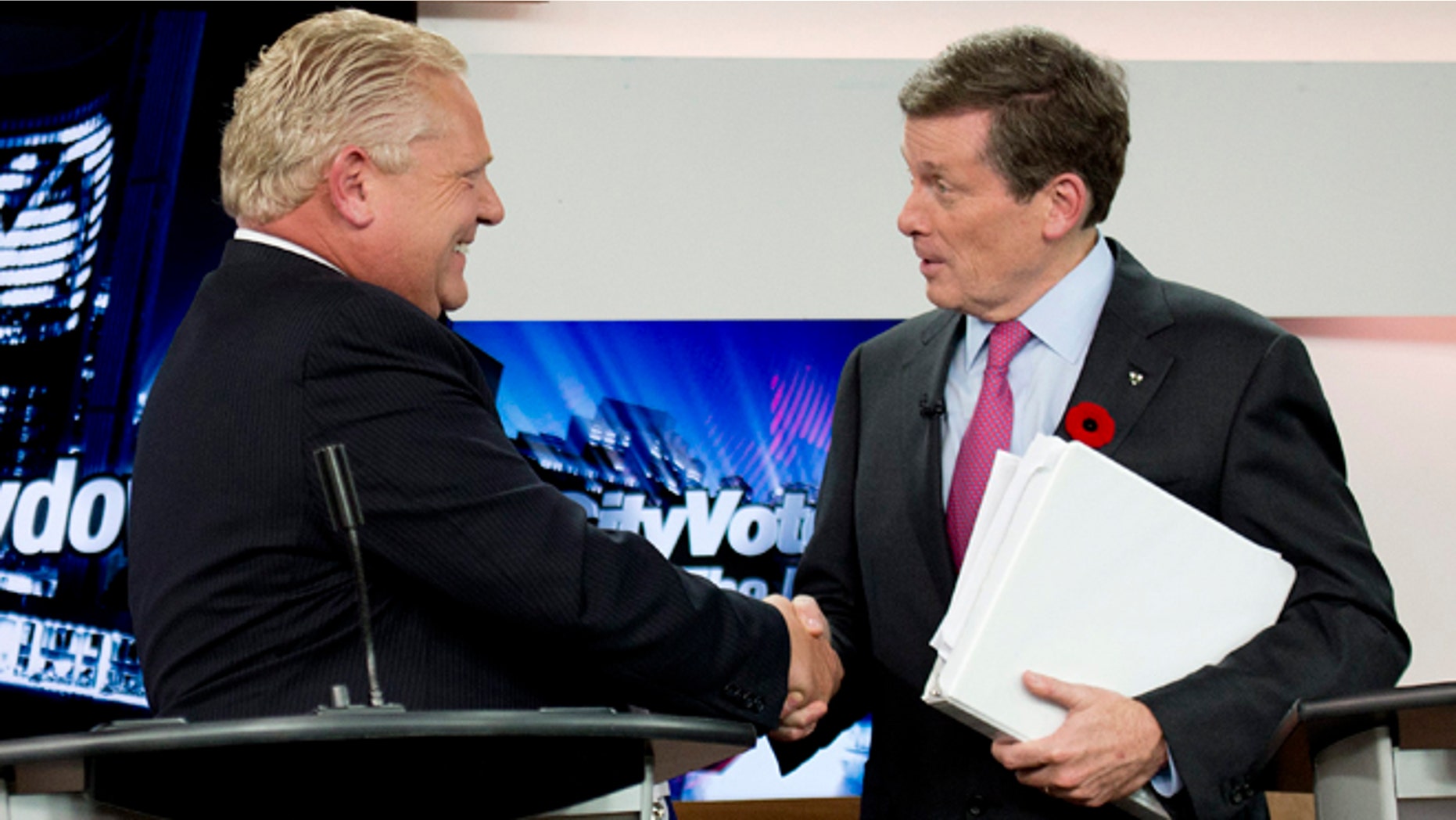 Oct. 23, 2014: Toronto mayoral candidates Doug Ford, left, and John Tory shake hands during the final mayoral debate for the Toronto mayoral race in Toronto.