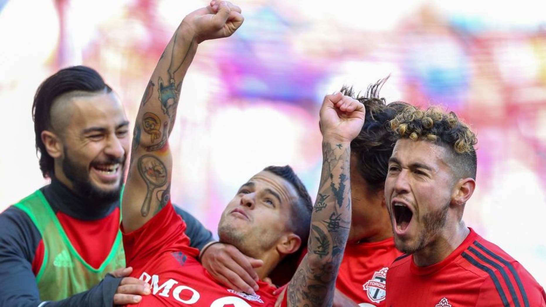 Mar 6, 2016; Harrison, NJ, USA; Toronto FC forward Sebastian Giovinco (10) celebrates his goal against the New York Red Bulls during the second half at Red Bull Arena. Toronto FC won, 2-0. Mandatory Credit: Vincent Carchietta-USA TODAY Sports