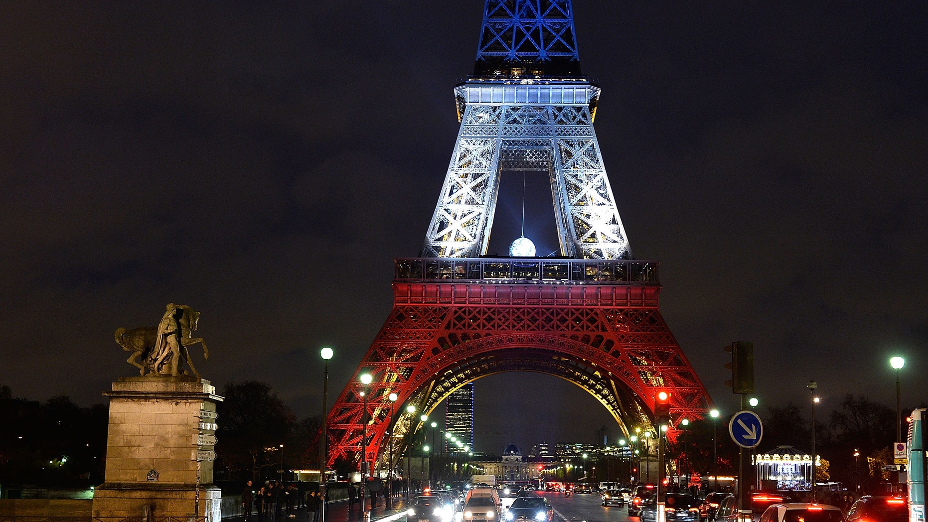PARIS, FRANCE - NOVEMBER 20: The Eiffel Tower is illuminated in Red, White and Blue in honour of the victims of Friday's terrorist attacks on November 20, 2015 in Paris, France. Following the terrorist attacks in Paris last week, which claimed 130 lives and injured hundreds more, people continue to mark their solidariity for the victims. (Photo by Pascal Le Segretain/Getty Images)