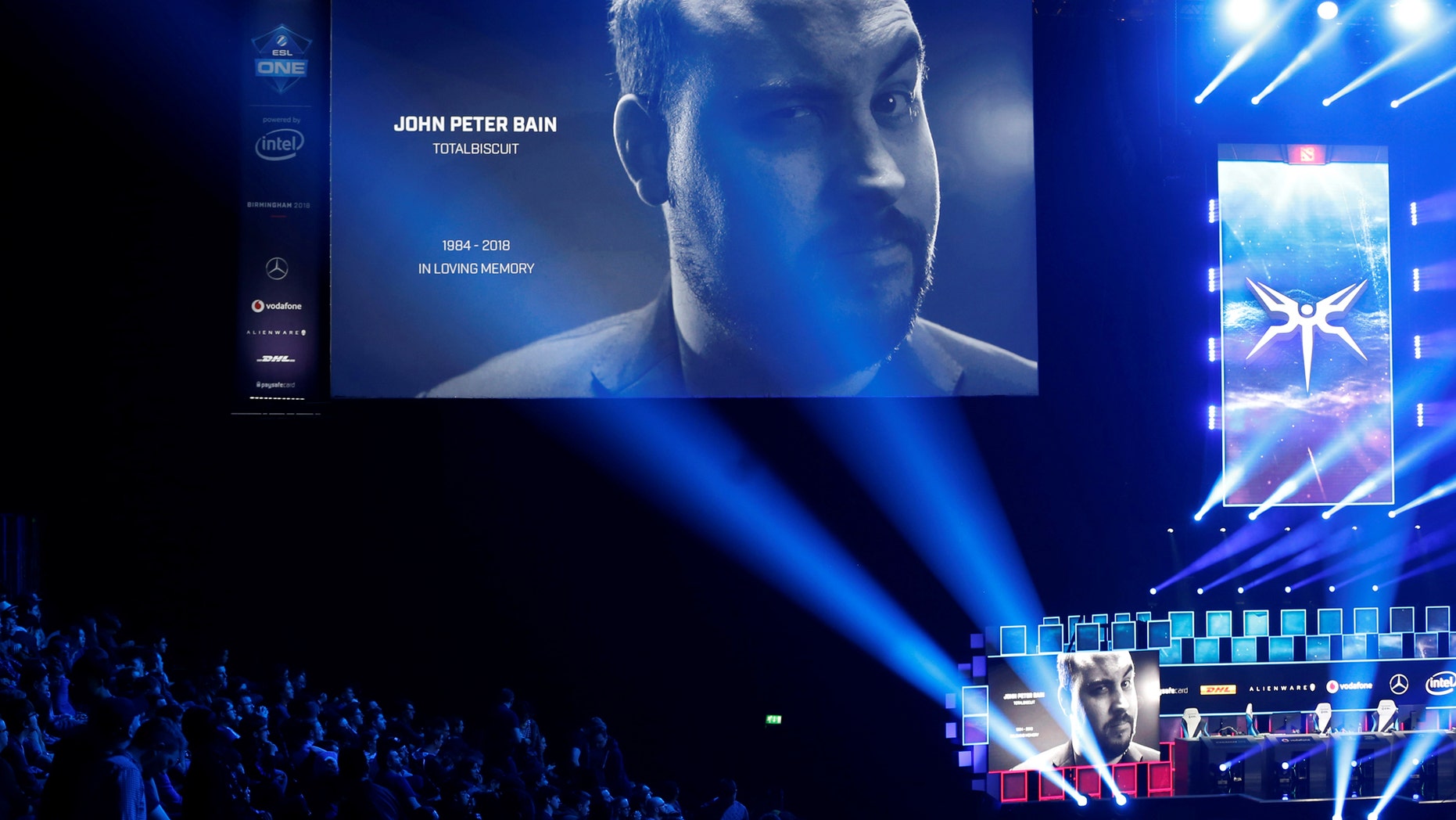 Esports - ESL One - Dota 2 Major - Arena Birmingham, Birmingham, Britain - May 26, 2018 Fans observe a minute's silence in memory of YouTube star John Peter Bain, also known as TotalBiscuit Action Images via Reuters/Ed Sykes - RC1B610D2F90