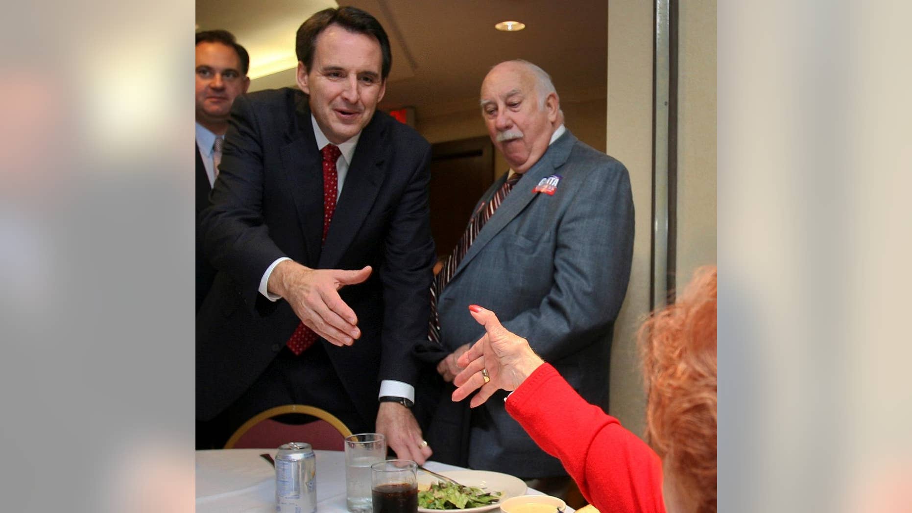 Minnesota Gov. Tim Pawlenty reaches to shake hands with Mary Smyk during a campaign luncheon for Republican congressional candidate Frank Guinta, back left, in Manchester, N.H., Thursday, Sept. 30,2010. Pawlenty is packing in three fund raisers for Republican candidates in New Hampshire. (AP Photo/Jim Cole)