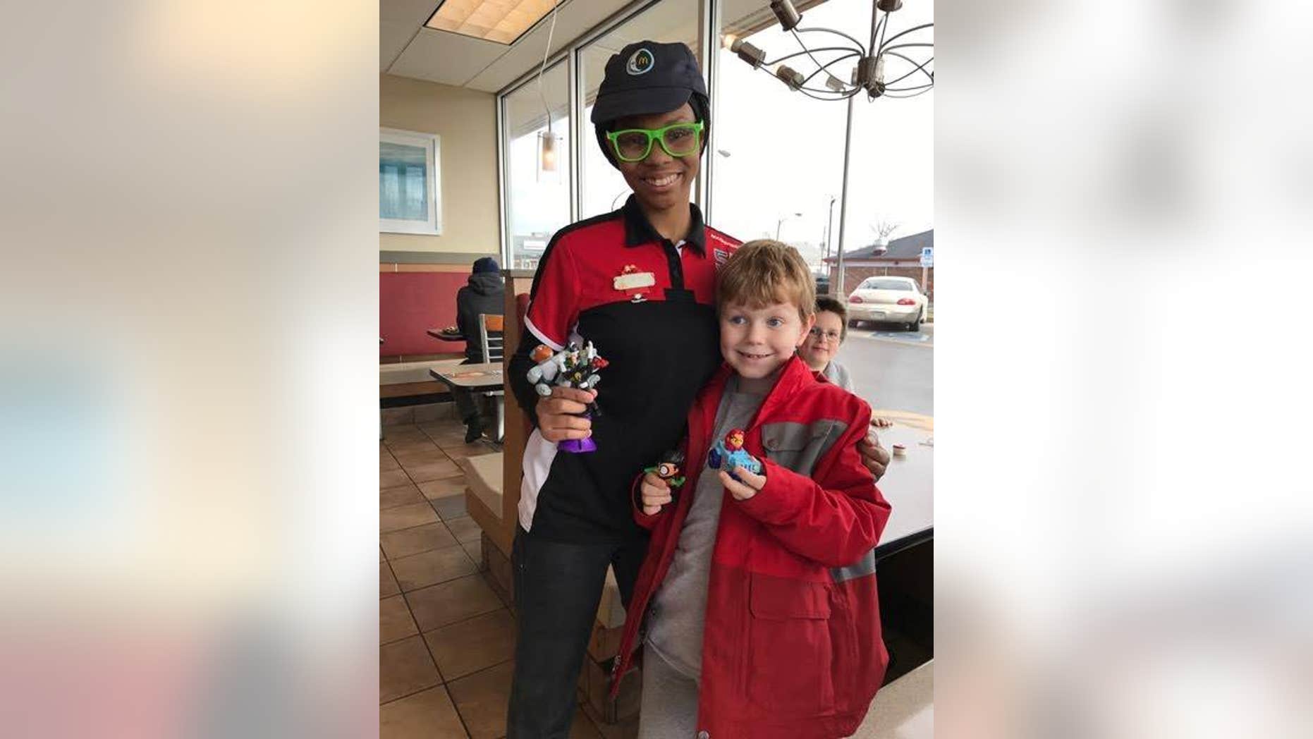 Leif poses with his Teen Titans toy and TQ, who made sure he got it.