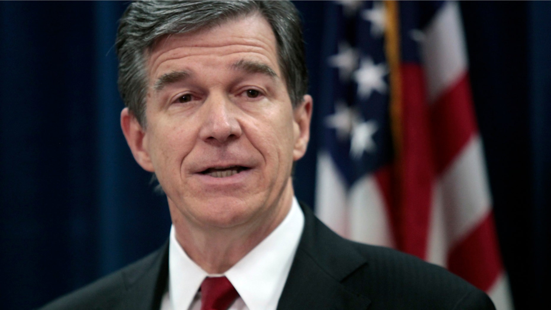 March 29, 2016: North Carolina Attorney General Roy Cooper speaks at a news conference in his state offices in Raleigh.