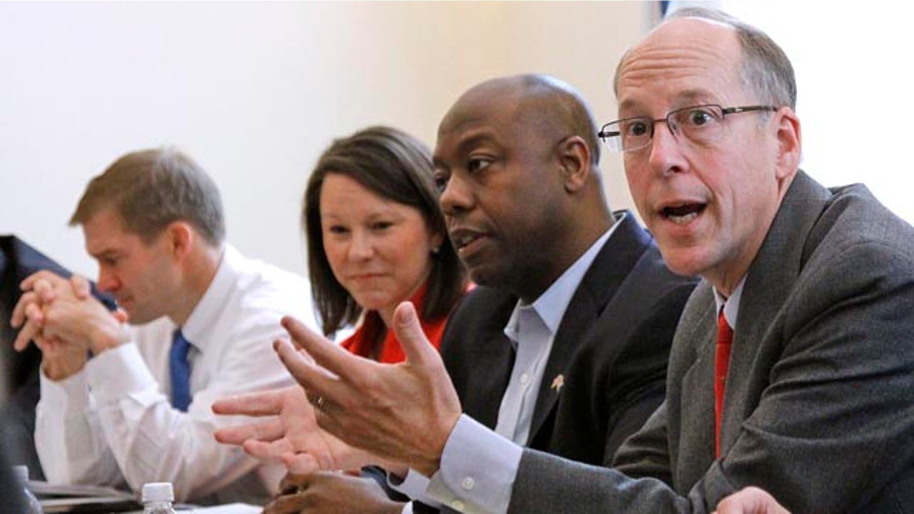 Nov. 9: Republican Majority Transition Chairman Rep. Greg Walden, R-Ore.; right, gestures on Capitol Hill during a photo opportunity with the transition team.