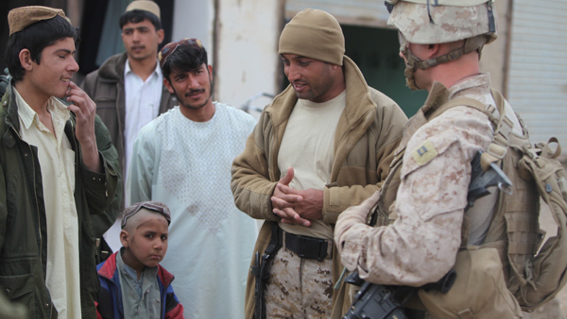 A group of U.S. Marines are fighting for their Afghan interpreter, Zia, pictured second from right, to obtain a Special Immigrant Visa to enter the U.S.