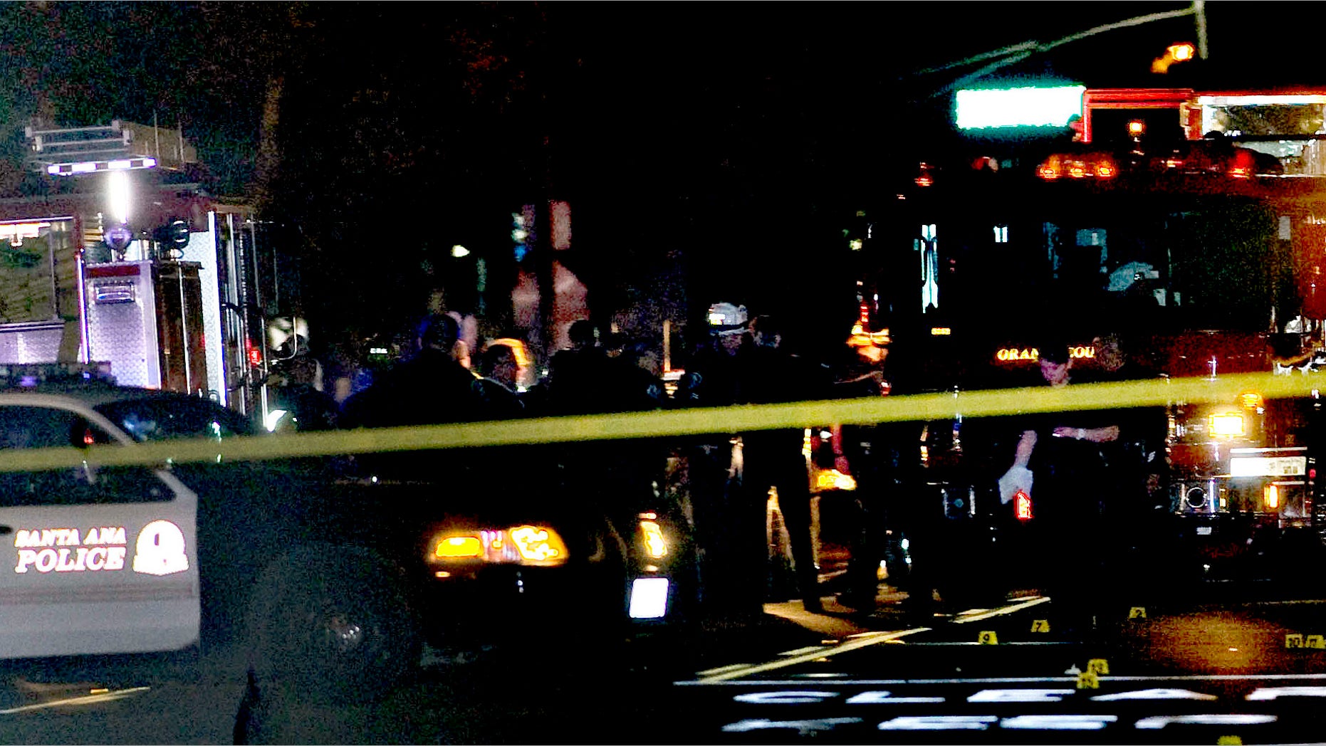 Oct. 31, 2014: Police and emergency respoders at the scene where three teenage girls trick-or-treating in costume were hit by a vehicle and killed while walking across a Southern California intersection in Santa Ana Calif.