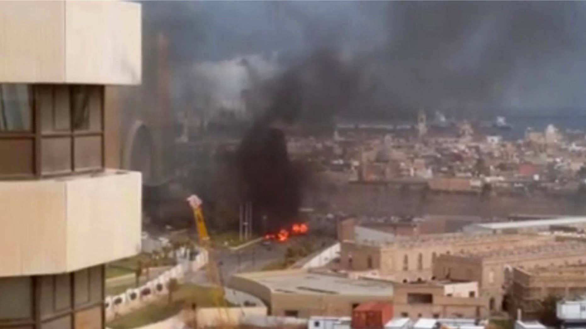 Jan. 27, 2015: In this image made from video posted by a Libyan blogger, the Cortinthia Hotel is seen under attack in Tripoli.