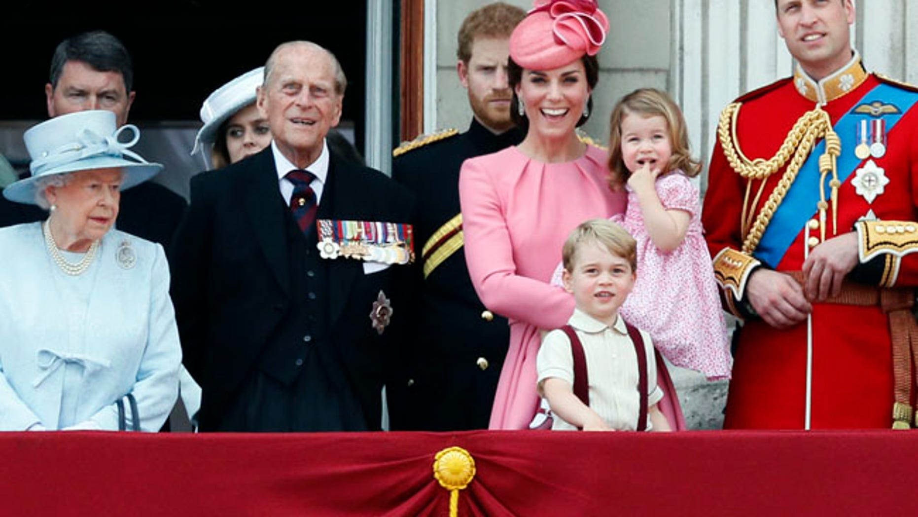 From left, Britain's Queen Elizabeth II, Prince Philip, the Duke of Edinburgh, Kate, The Duchess of Cambridge, Prince William and their children Prince George and Princess Charlotte appear on the balcony of Buckingham Palace, after attending the annual Trooping the Colour Ceremony in London, Saturday, June 17, 2017. Prince Harry is in the background. (AP Photo/Kirsty Wigglesworth)
