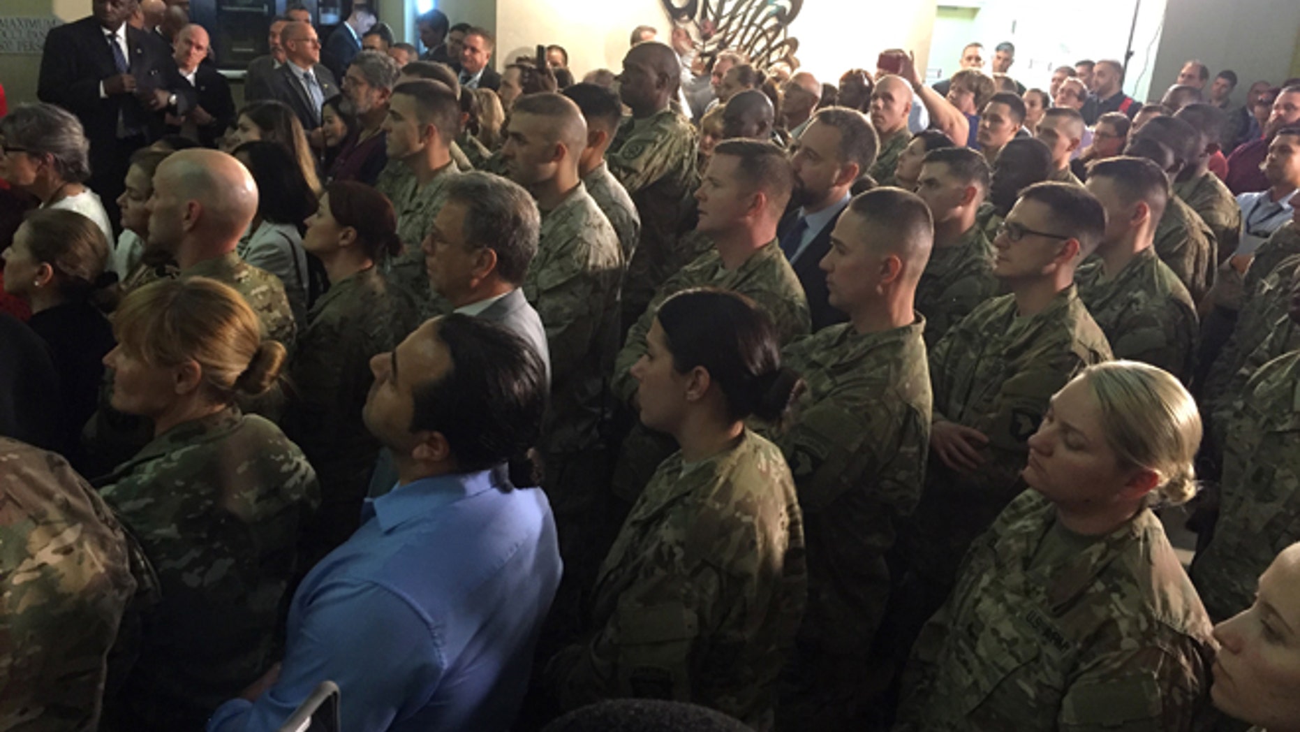 U.S. military members serving in Iraq listen as Vice President Joe Biden greets them, Thursday, April 28, 2016, at the U.S. Embassy in Baghdad. (AP Photo/Josh Lederman)