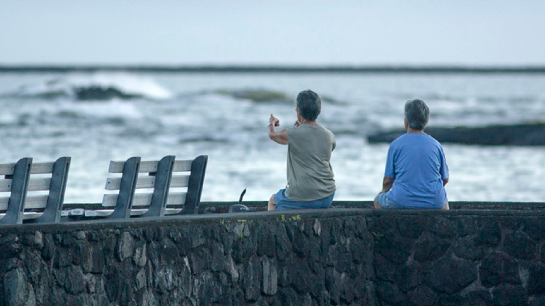 Aug. 31: Jeri, left, and Jen Nakano, both from Hilo, sit near the ocean in Hilo, Hawaii.