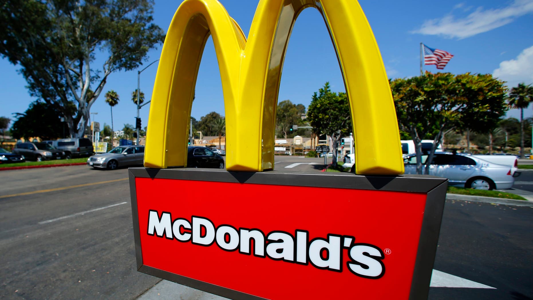 A McDonald's sign is shown at the entrance to one of the company's restaurants in Del Mar, California September 10, 2012. REUTERS/Mike Blake (UNITED STATES - Tags: BUSINESS)