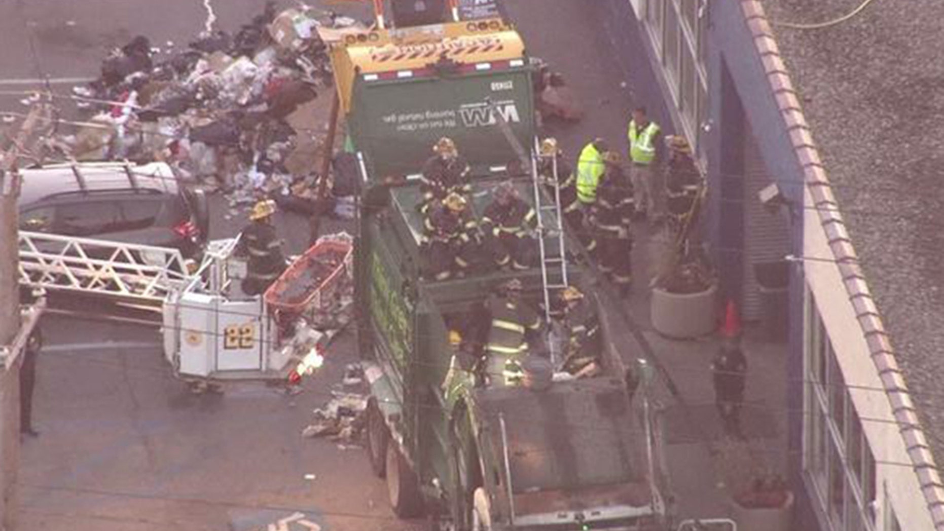 Nov. 27, 2017: Firefighters worked for hours Monday morning to rescue a man stuck in a garbage truck compactor in Philadelphia.