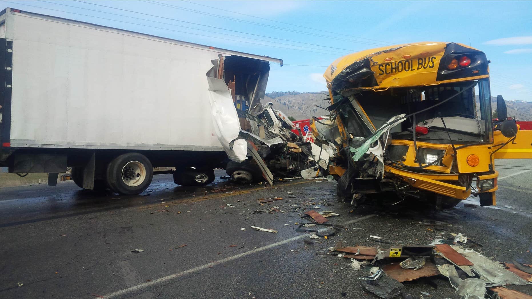 March 5, 2015: This photo provided by the Washington State Patrol shows the scene of an accident in which a motorist was killed and five students and others were injured in a crash involving a school bus, box truck and car near Orondo in Central Washington state.