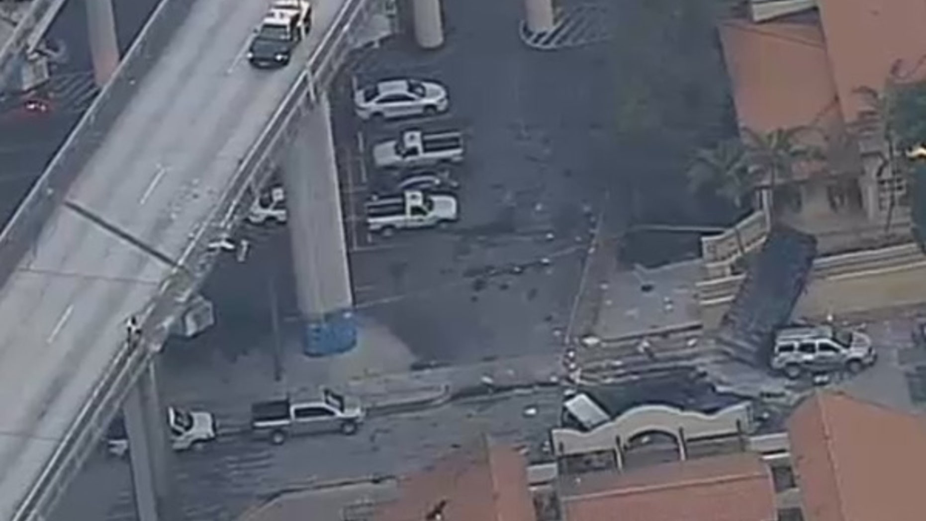 A garbage truck fell nearly 100 feet off Interstate 95 in Miami on Monday.