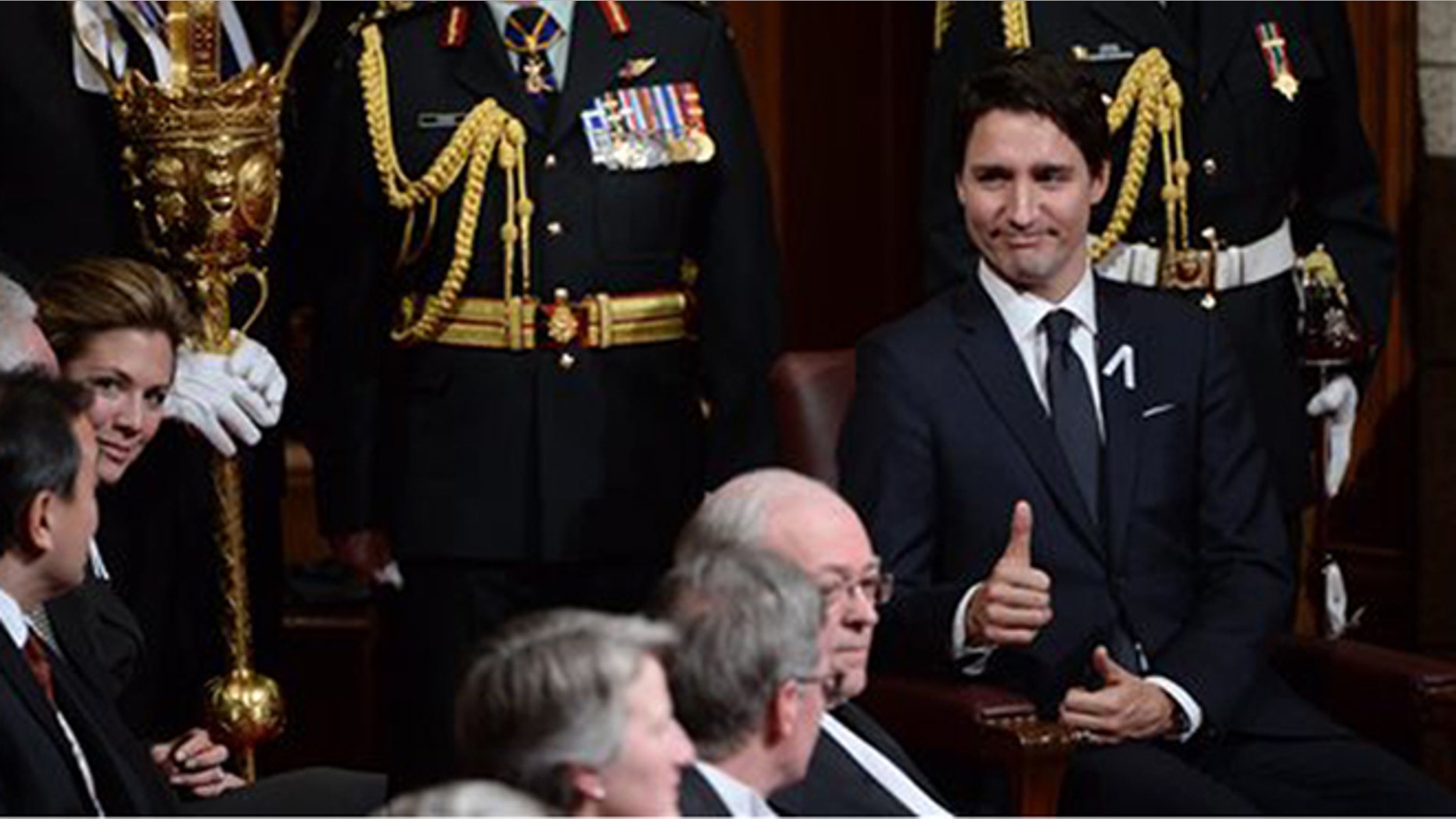 Prime Minister Justin Trudeau gives a thumbs-up before the Speech from the Throne in the Senate Chamber on Parliament Hill in Ottawa, Friday, Dec. 4, 2015. (Sean Kilpatrick/The Canadian Press via AP)