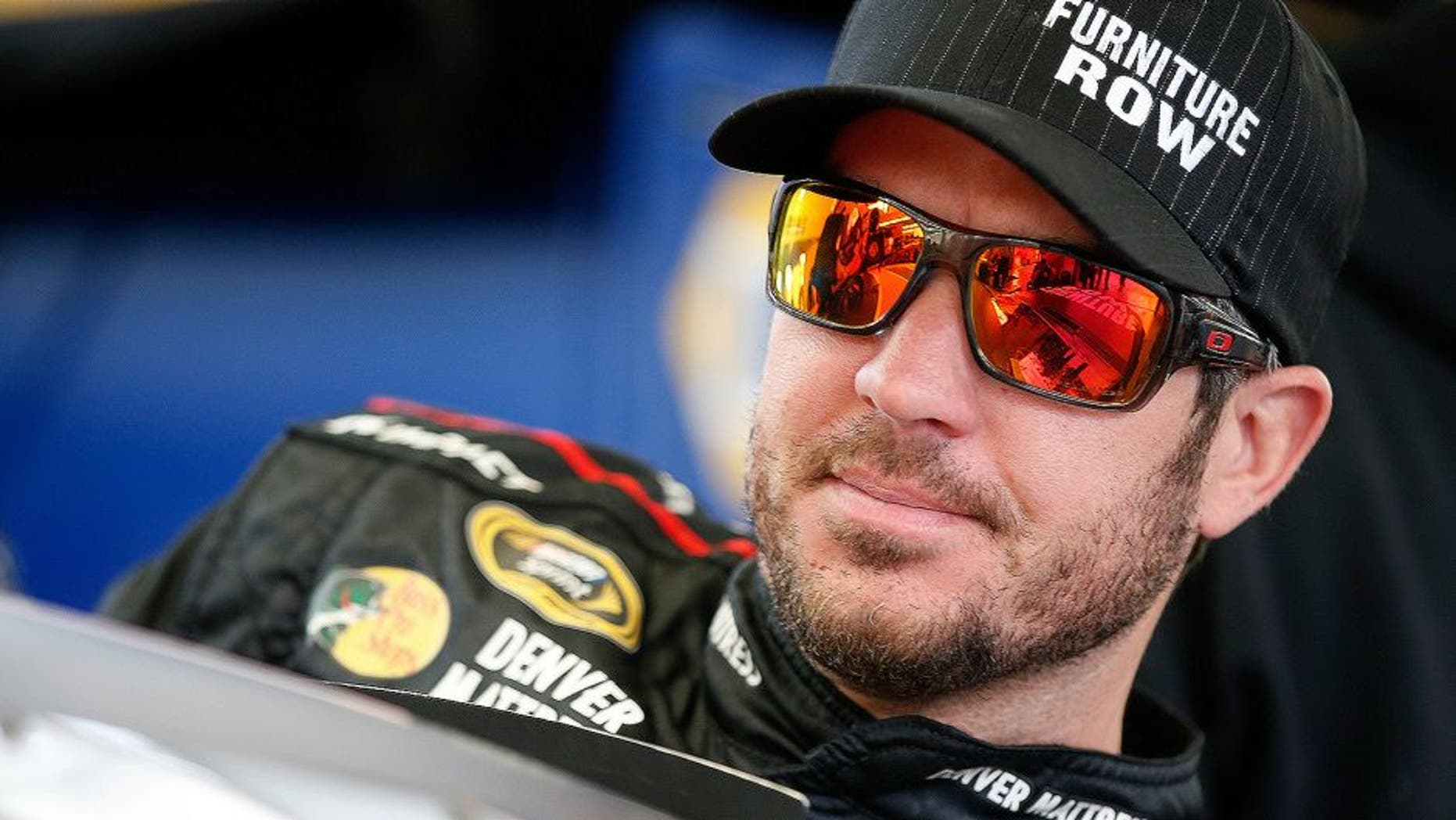 LAS VEGAS, NV - MARCH 05: Martin Truex Jr, driver of the #78 Furniture Row Toyota, steps into his car in the garage area during practice for the NASCAR Sprint Cup Series Kobalt 400 at Las Vegas Motor Speedway on March 5, 2016 in Las Vegas, Nevada. (Photo by Todd Warshaw/Getty Images)