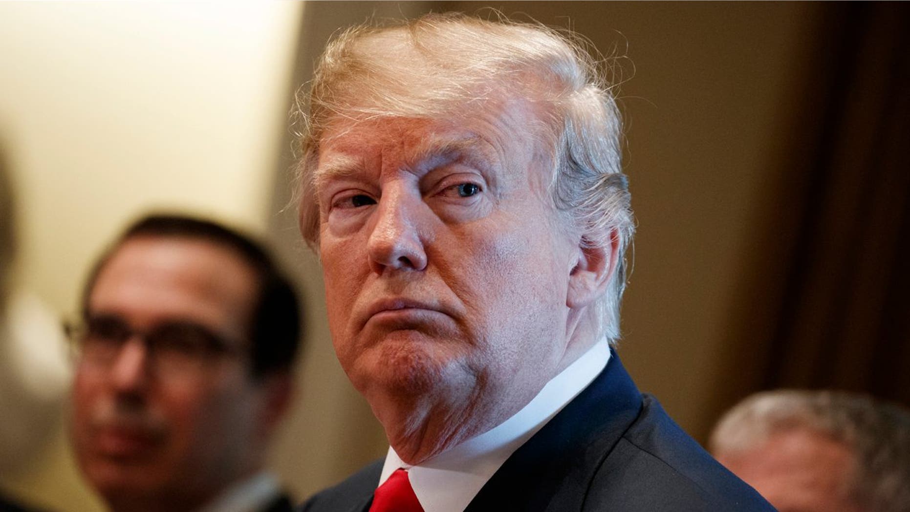 FILE - In this June 20, 2018 file photo, President Donald Trump listens during a meeting with Republican members of Congress on immigration in the Cabinet Room of the White House in Washington. The separation of families at the U.S.-Mexico border caught the attention of the world and prompted mass outrage, but it only tells a small part of the story surrounding the Trump administrationââ¬â¢s immigration policy. (AP Photo/Evan Vucci, file)