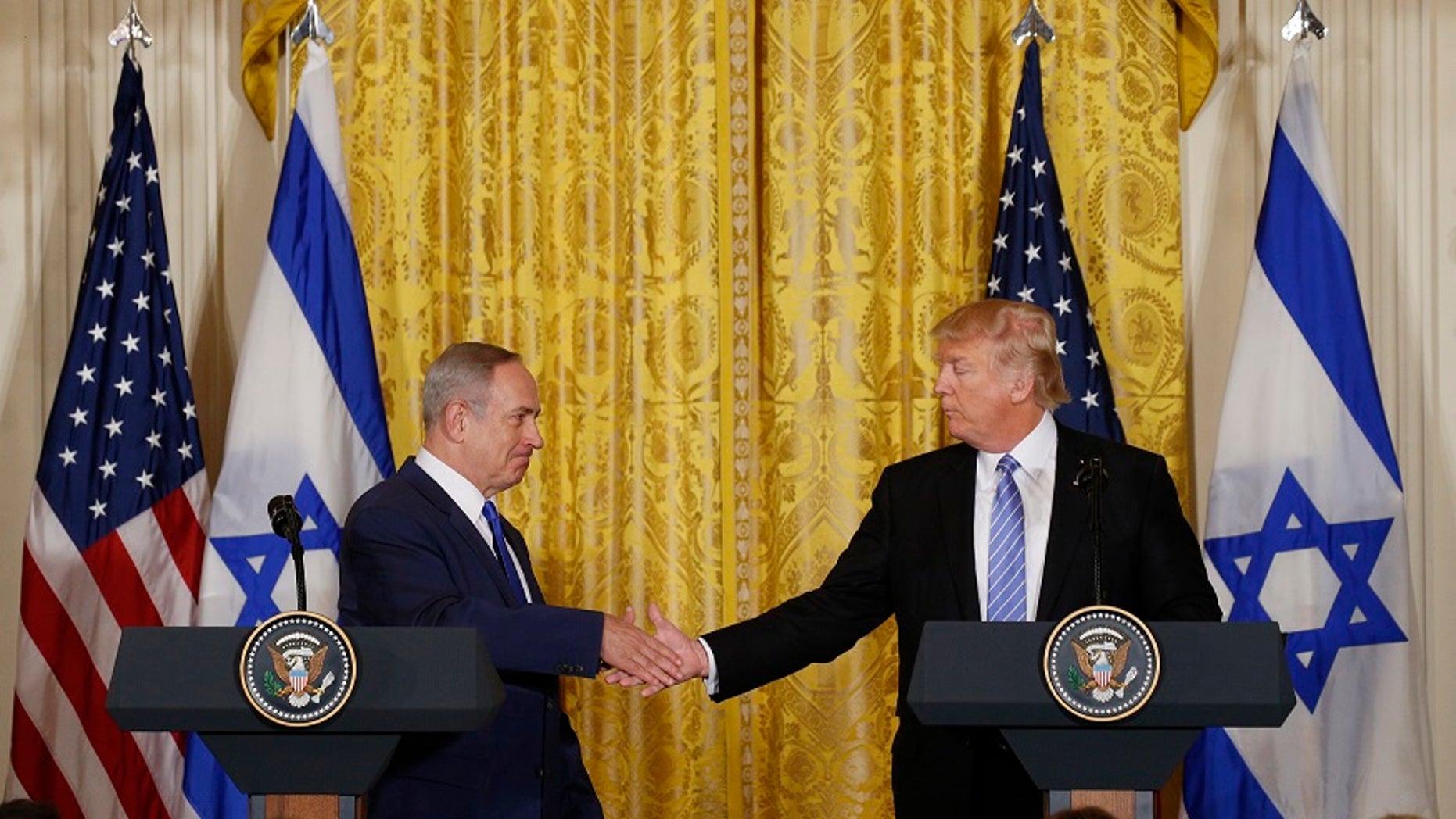 U.S. President Donald Trump greets Israeli Prime Minister Benjamin Netanyahu after a joint news conference at the White House. The two men are set to meet next week in Israel during Trump's first foreign trip as president.