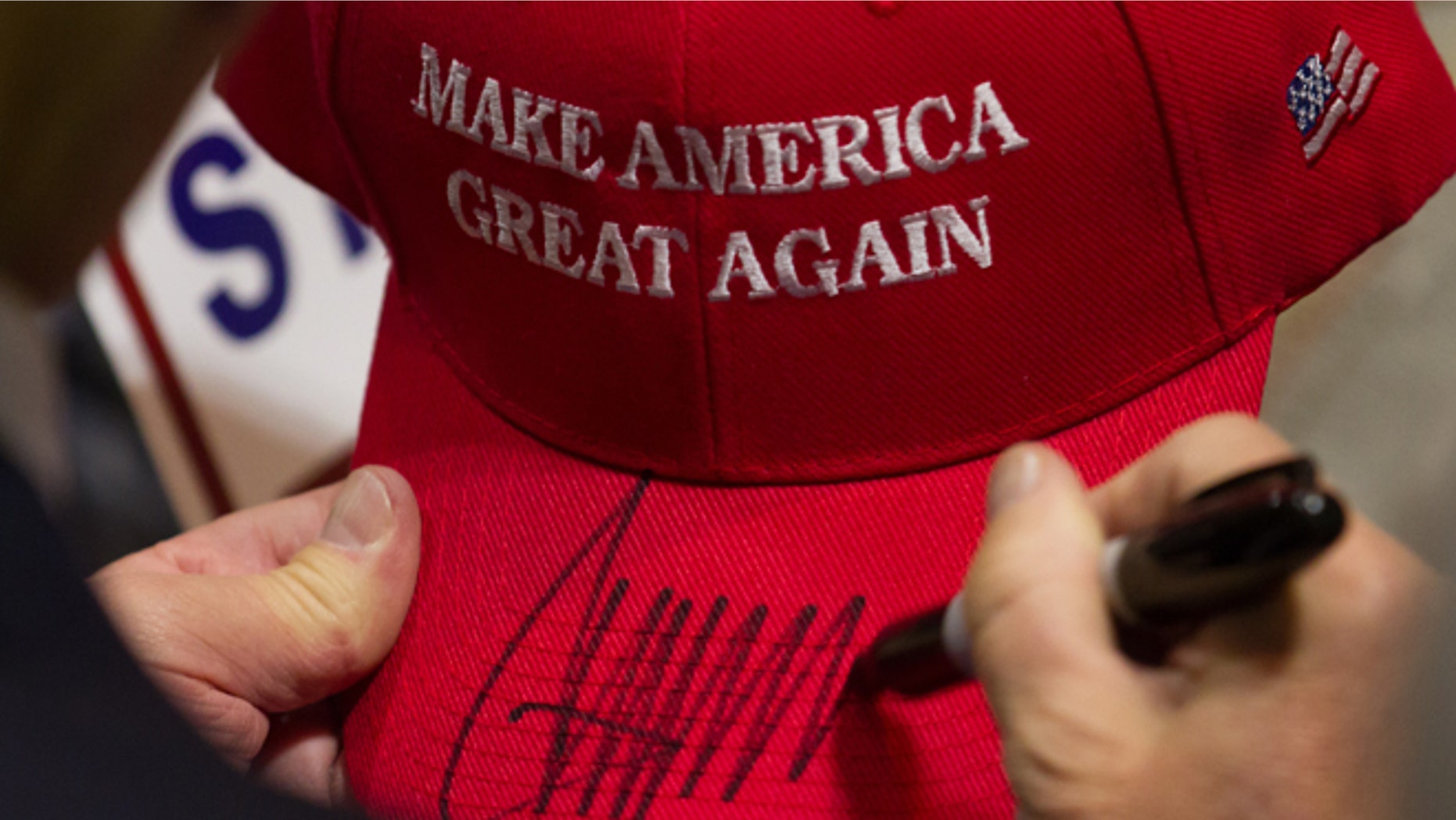 HARTFORD, CT - APRIL 15: Republican presidential candidate Donald Trump signs a hat after speaking at a rally at the Connecticut Convention Center on April 15, 2016 in Hartford, Connecticut. The 2016 Connecticut Republican Primary is scheduled for April 26, 2016. (Photo by Matthew Cavanaugh/Getty Images)