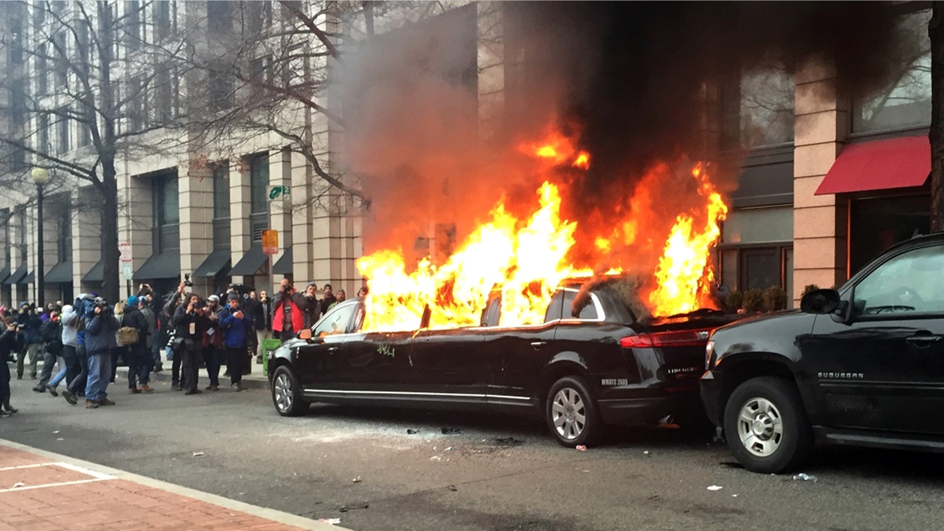 Protesters set a parked limousine on fire in downtown Washington, Friday, Jan. 20, 2017, during the inauguration of President Donald Trump.