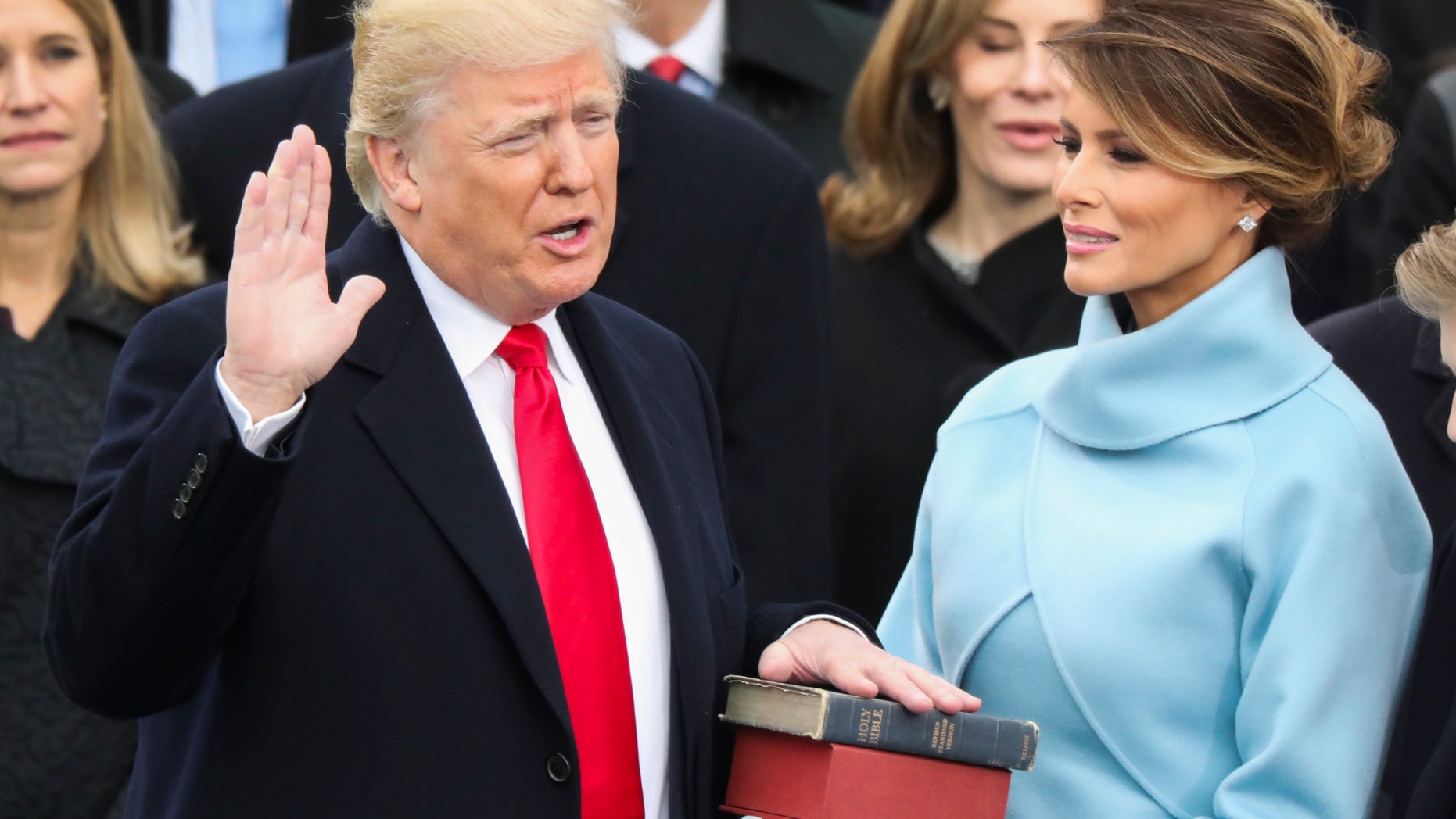 Donald Trump is sworn in as the 45th president of the United States as Melania Trump looks on during the 58th Presidential Inauguration at the U.S. Capitol in Washington, Friday, Jan. 20, 2017. (AP Photo/Andrew Harnik)
