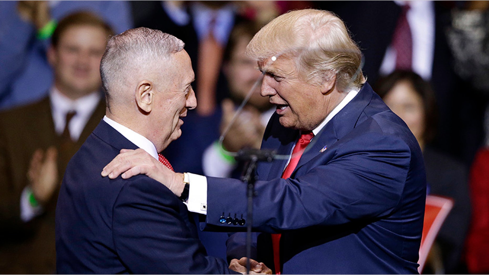 In this Dec. 6, 2016, photo, President-elect Donald Trump introduces retired Marine Corps Gen. James Mattis as his nominee for Secretary of Defense while speaking to supporters during a rally in Fayetteville, N.C.