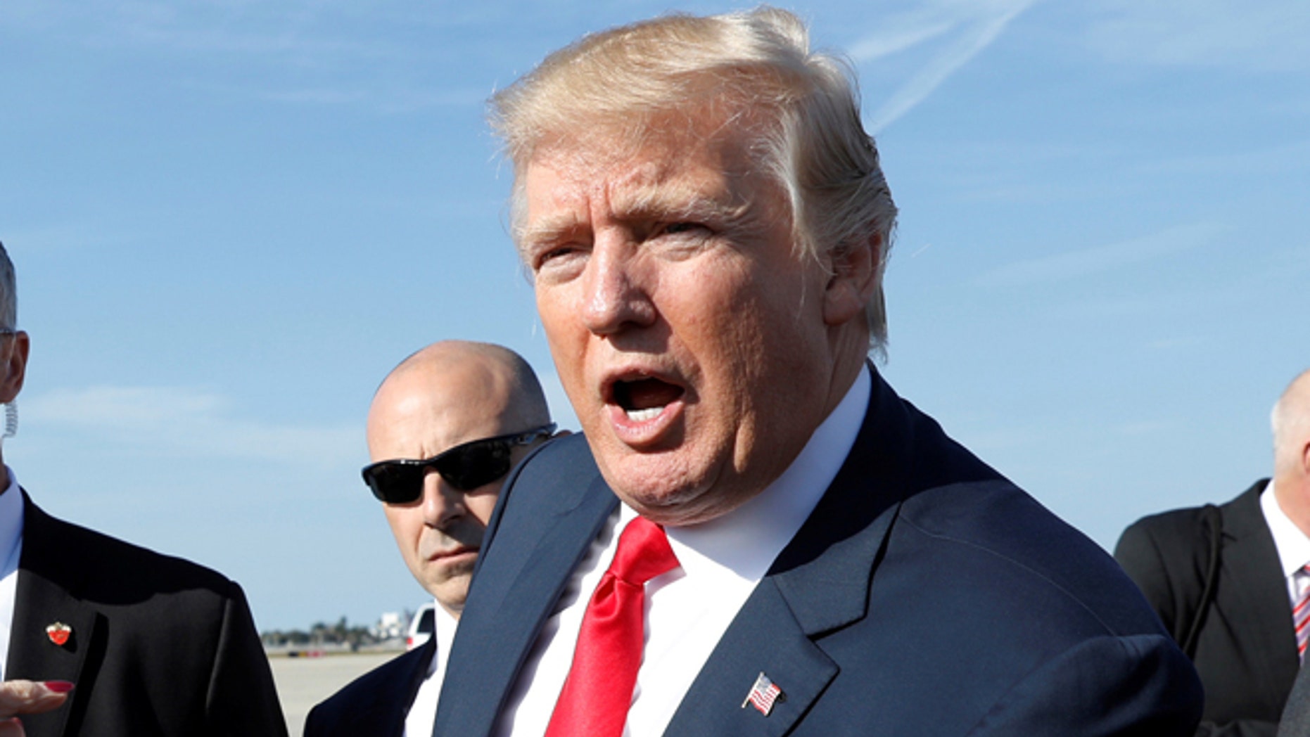 President Donald Trump greets well-wishers upon his arrival in West Palm Beach, Fla., on Feb. 17, 2017. (REUTERS/Kevin Lamarque)