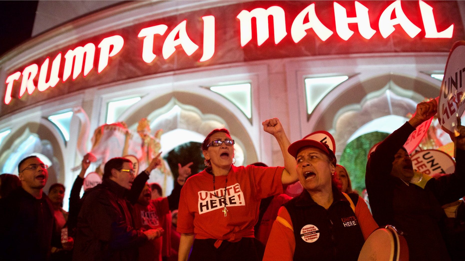 Oct. 24, 2014: Marita Luna (C) and Miriam Ramos (2nd R) joins other union members from UNITE HERE Local 54 as they rally outside the Trump Taj Mahal Casino in Atlantic City,