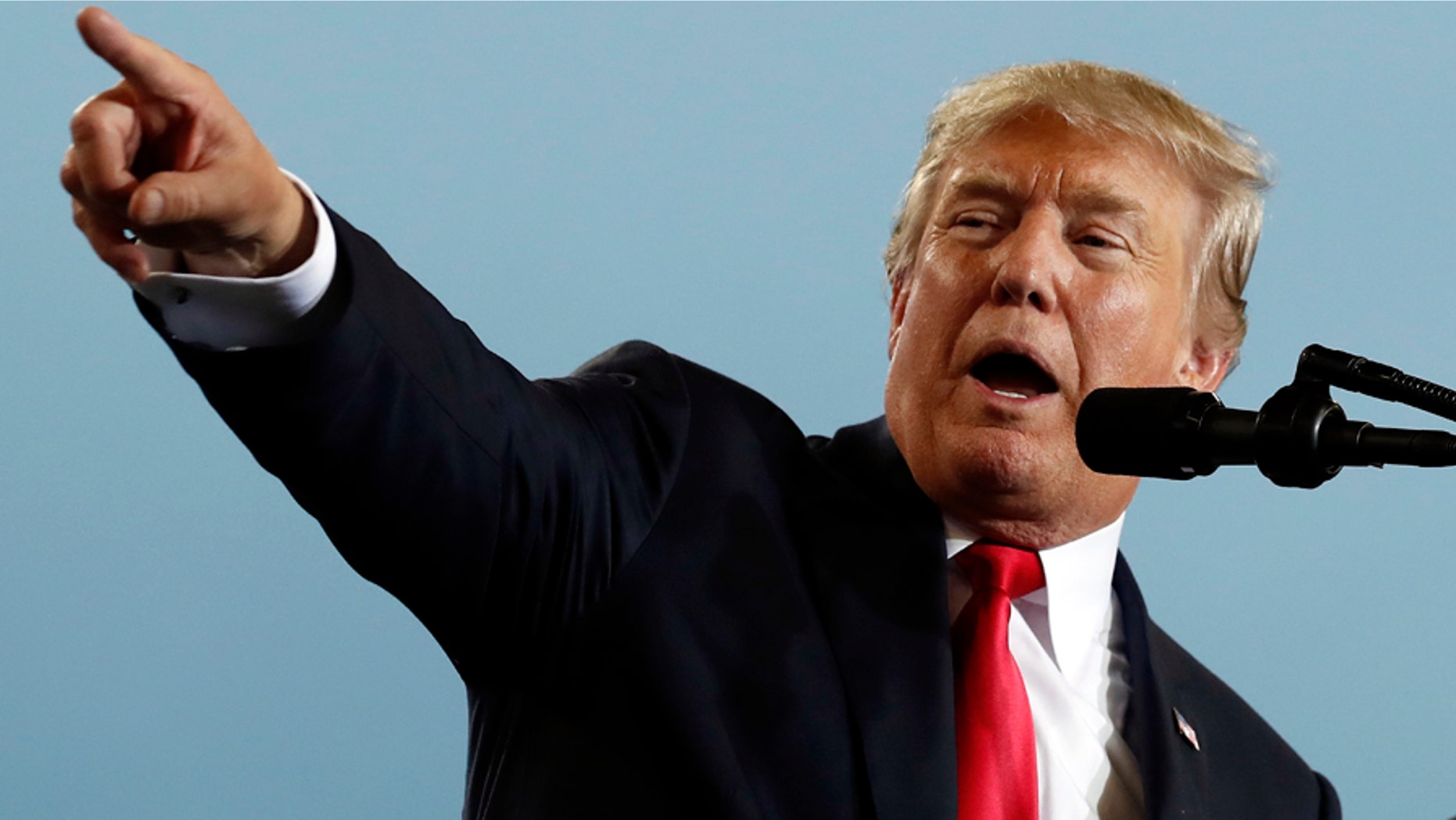 President Trump on Saturday called for his own Justice Department to publicly release who paid for a salacious dossier that includes unverified allegations about his connections with Russia.