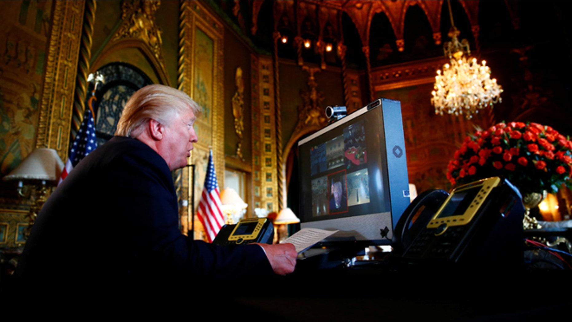 President Donald Trump speaks via videoconference to U.S. troops, from his Mar-a-Lago estate in Palm Beach, Fla., Nov. 23, 2017.
