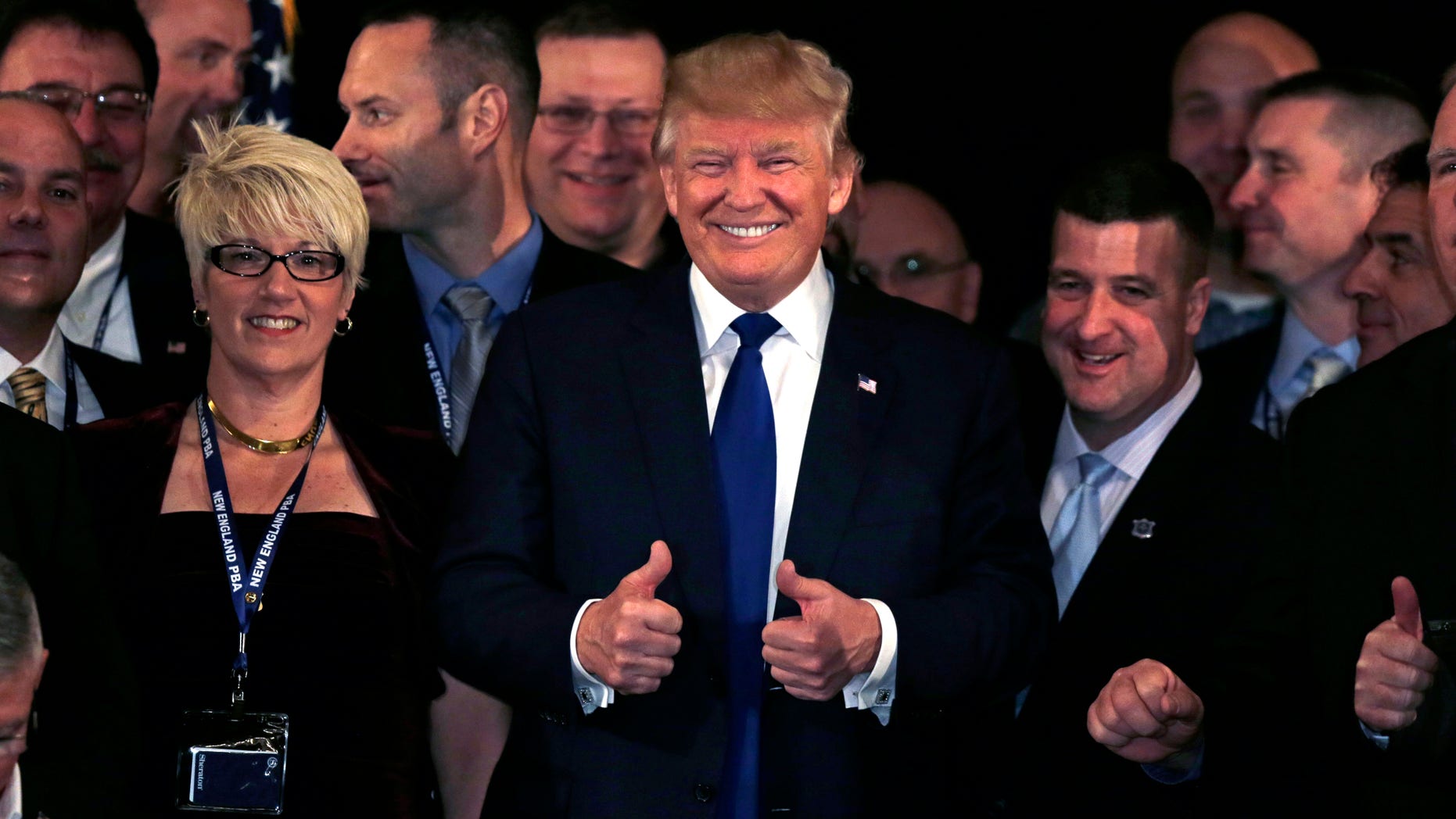 Dec. 10, 2015 - Republican presidential candidate Donald Trump flashes thumbs up after being endorsed at a regional police union meeting in Portsmouth, N.H. (AP)