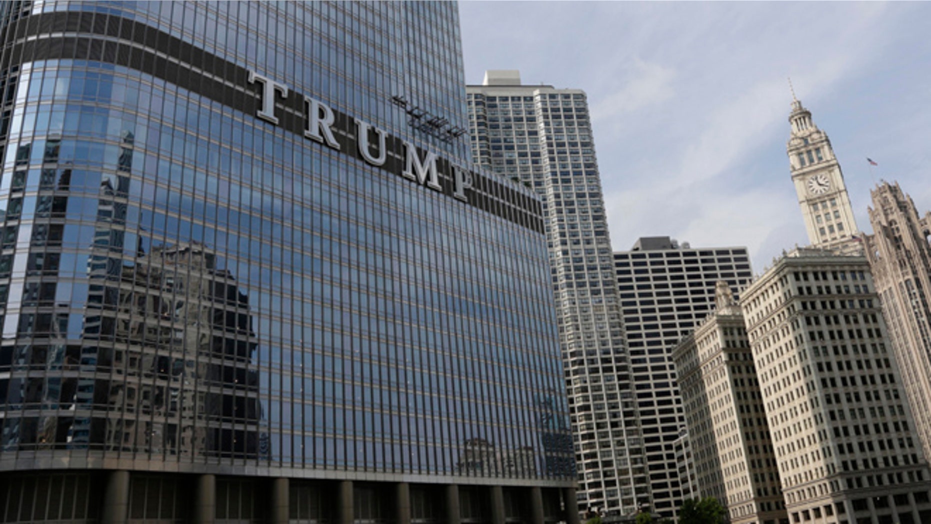 Newly installed 20-foot-tall letters spelling out T-R-U-M-P are seen on the side of real estate billionaire Donald Trump's skyscraper in Chicago, Thursday, June 12, 2014. The letters have triggered a war of words between Trump and Chicago Mayor Rahm Emanuel. (AP Photo/Stacy Thacker)